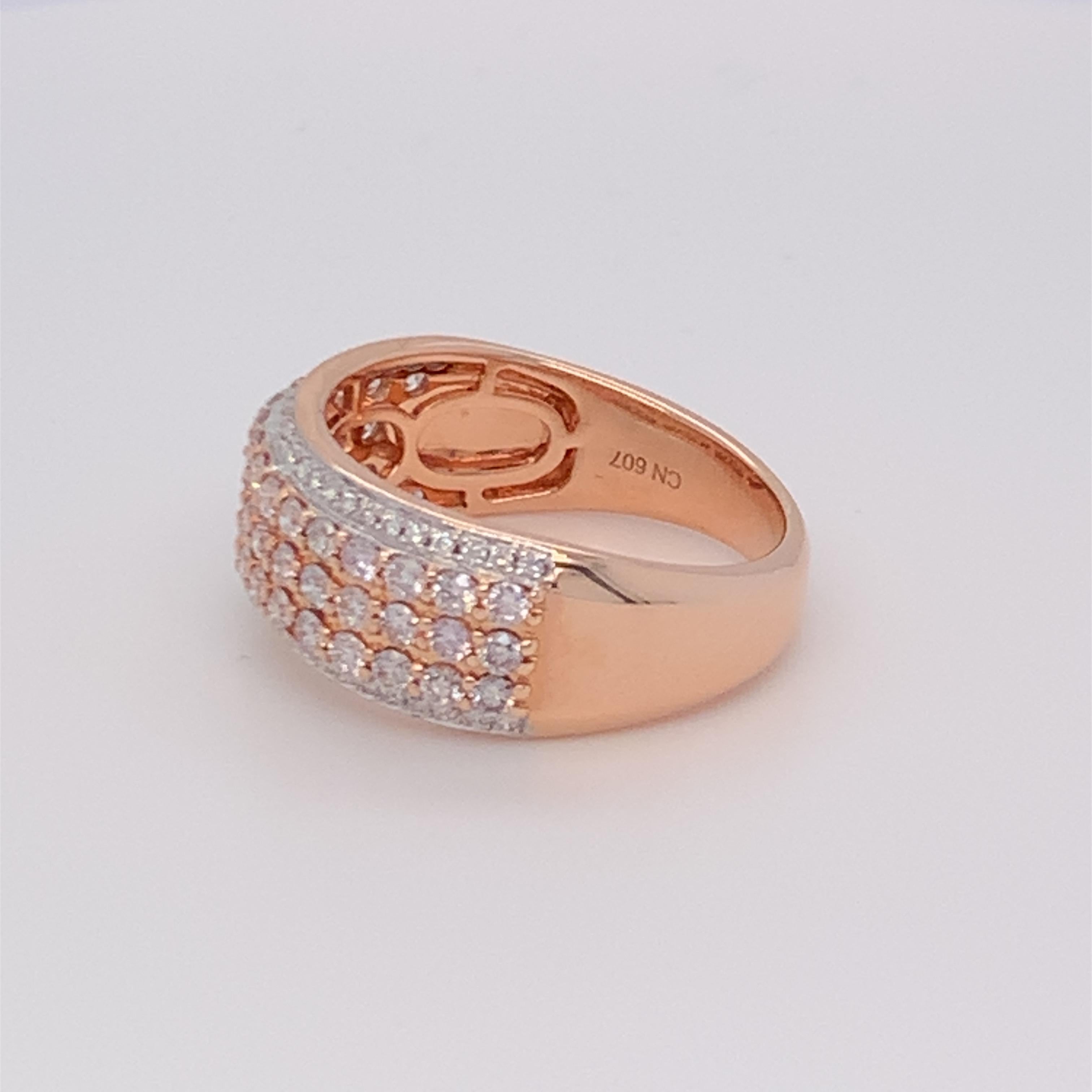 This beautiful five row diamond ring has a combination of pink band in between two rows of white diamonds. Carefully finished with hand by skilled craftsmen and mounted in 14K two tone gold.  
Pink Diamond: 0.80ct
White Diamond: 0.15ct
Gold: 14K Two