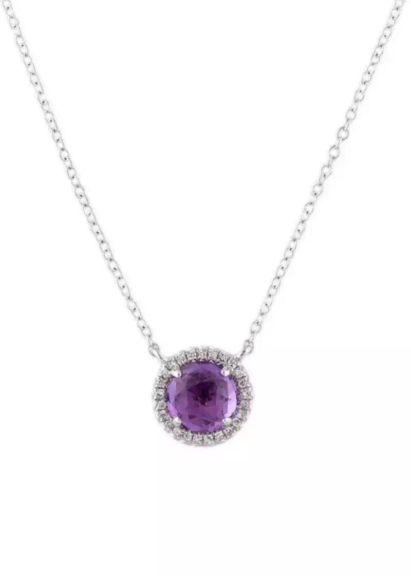 This Amethyst & Diamond Pendant is a stunning and timeless accessory that can add a touch of glamour and sophistication to any outfit. 
This pendant features a 0.95 Carat Round Purple Amethyst, with a Diamond Halo comprised of 0.06 Carats of Single