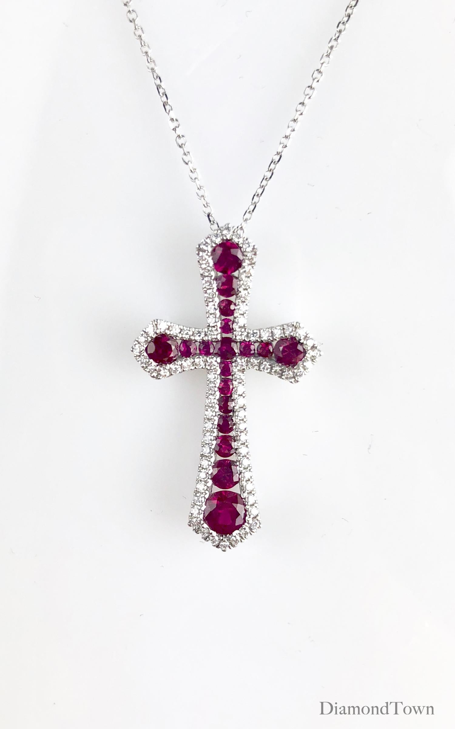 This handcrafted cross pendant has 0.95 carats round rubies surrounded by a halo of round white diamonds. The total diamond weight is 0.27 carats.

Many of our items have matching companion pieces. Please inquire.

An insurance appraisal certificate