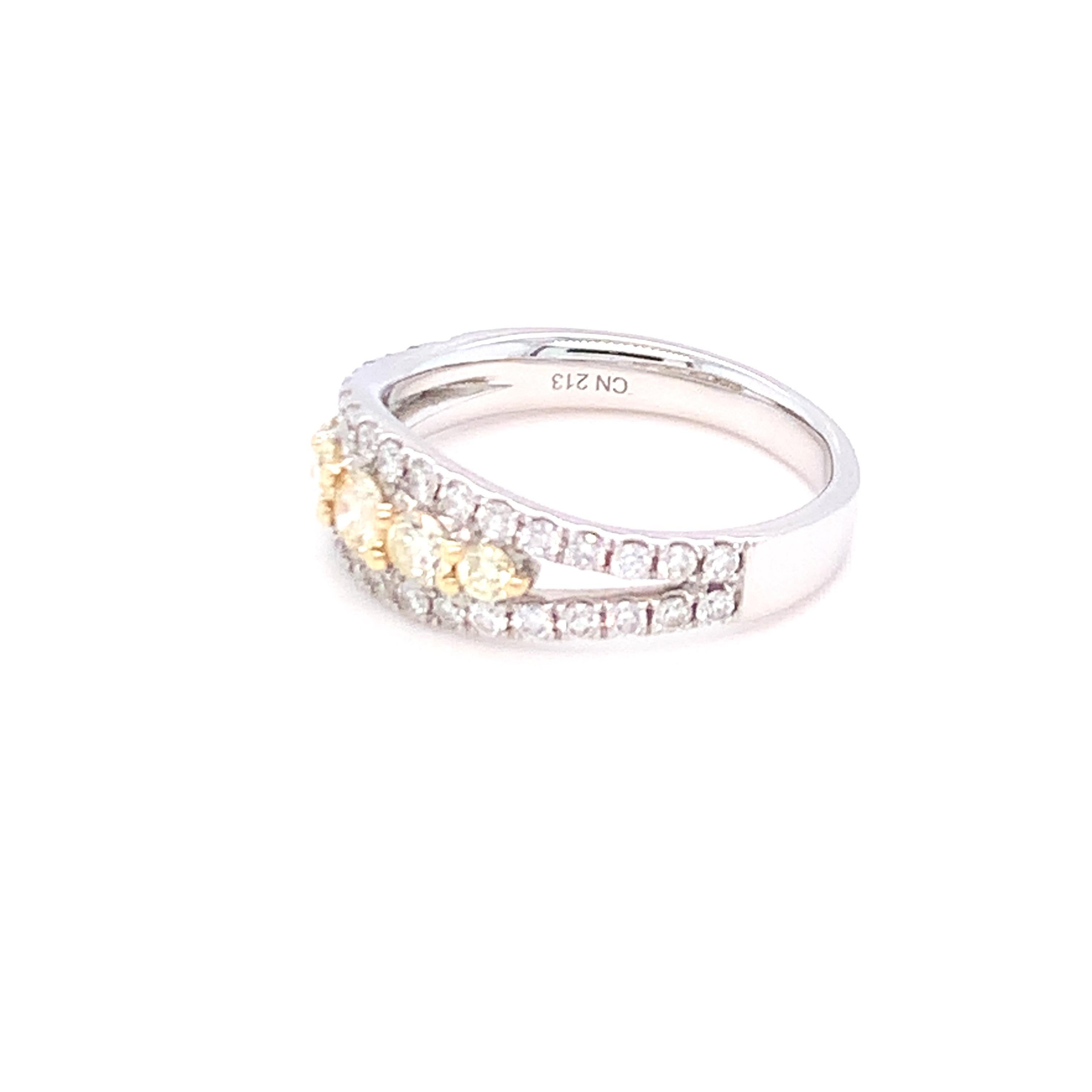 A combination of yellow and white diamond in three rows makes this band a simple and everyday wear piece of jewelry. Set in two tone gold and finished with hands by skilled artisans.
Yellow Diamond: 0.44ct
White Diamond: 0.51ct
Gold: 14K Two