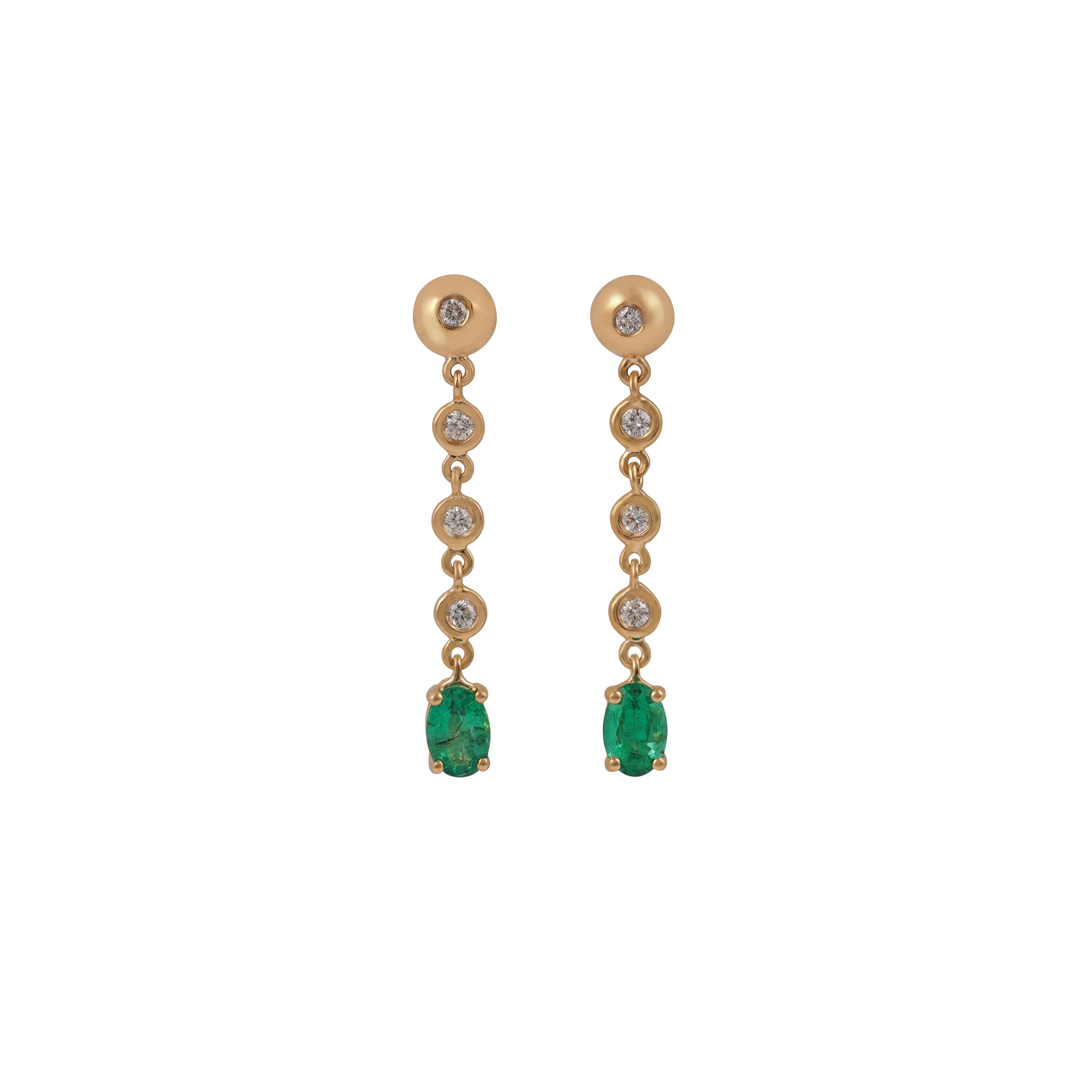 18K Gold long drop earrings with 8 round brilliant-cut diamonds 0.19 carats total weight, two oval shaped emeralds 0.95 carats total weight & Gold 18k 3.02gm.
