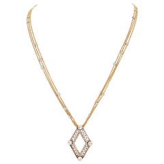 Ciondolo a forma di diamante da 0,95 carati in platino 18 carati con catena tripla