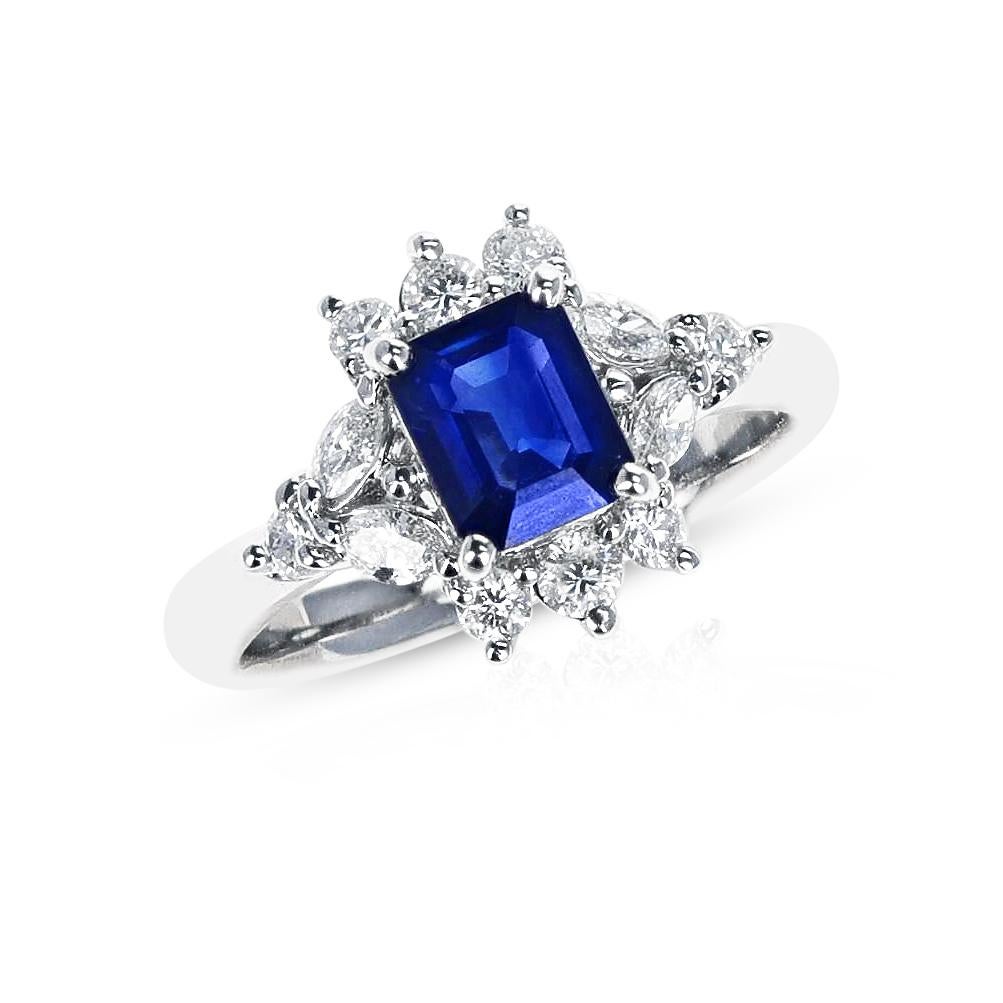 An appx. 0.95 ct. Sapphire surrounded by a total of appx. 0.56 cts. of Diamonds in an Engagement Ring made in Platinum. The ring size is 6.25 US and the total weight is 6.14 grams. 