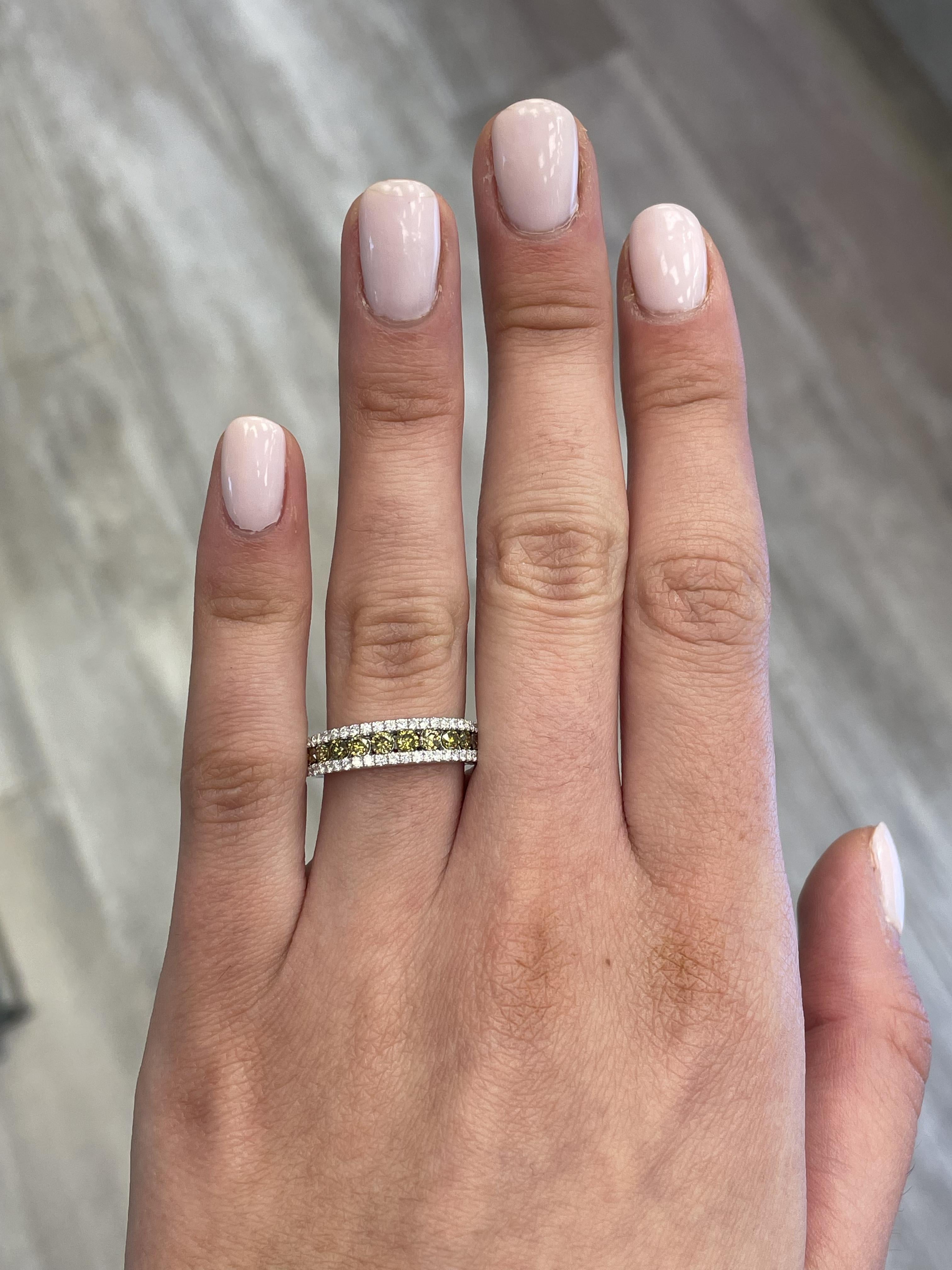 Lovely yellow to brownish yellow diamond cocktail ring.
0.95 carats total diamond weight.
11 round brilliant yellow diamonds, 0.64 carats. Approximately Fancy Yellowish Brown color and SI clarity. Complimented by 44 round diamonds, 0.31 carats.