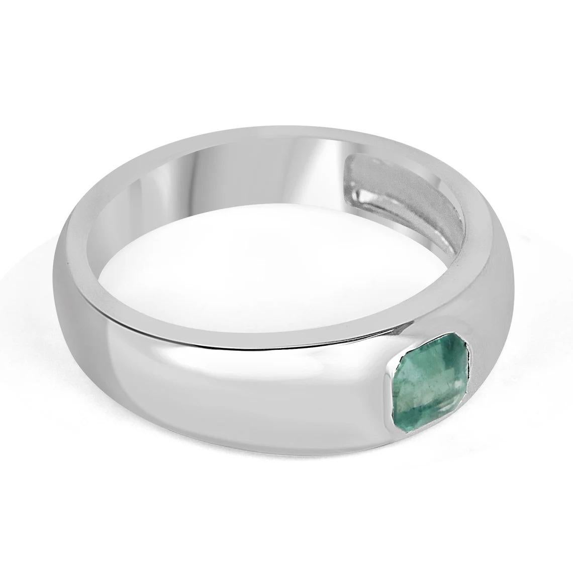 A lovely solitaire emerald ring; featuring an asscher-cut emerald from the origin of Zambia. The gemstone showcases a gorgeous light-medium green color with very good clarity and luster. Set in a secure solitaire bezel setting crafted in sterling