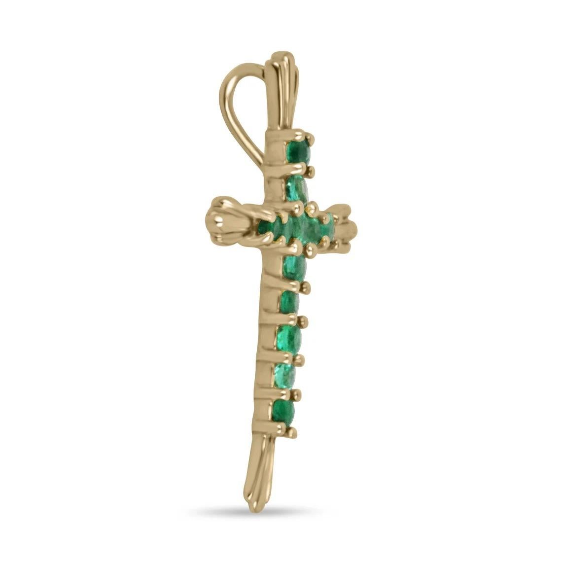 Featured is a stunning emerald cross pendant. Twelve prong set round cut emeralds are on full display. Showcasing a vivacious and bluish-green color that is lustrous and rich. Crafted in 18K yellow gold.

*Chain sold separately.

Setting Style: