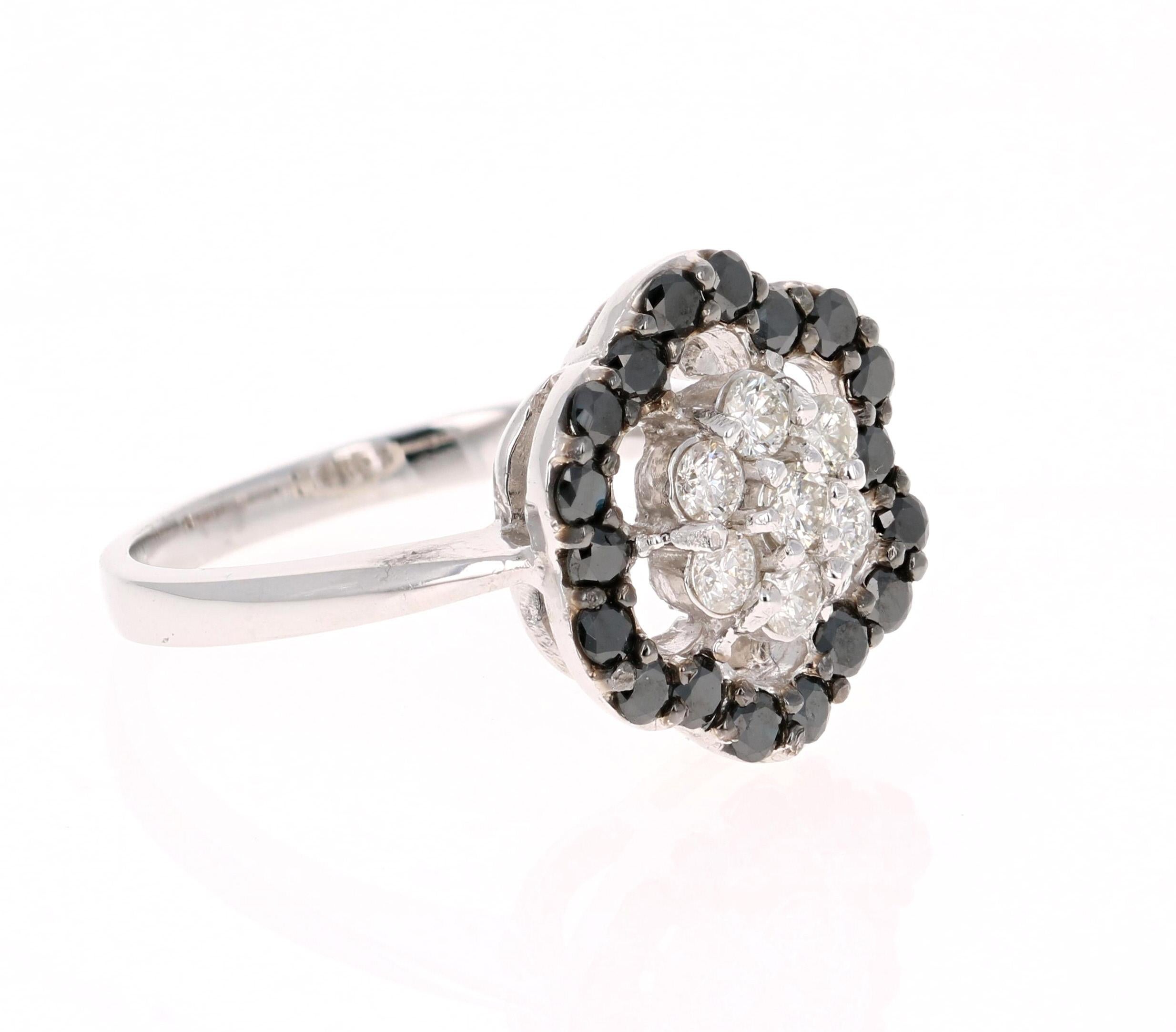 The flower design has 7 Round Cut Diamonds that weigh 0.37 carats and the floating halo has 18 Black Round Cut Diamonds that weigh 0.62 carats. The total carat weight of the ring is 0.99 Carats. 

It is beautifully set in 14 Karat White Gold and is