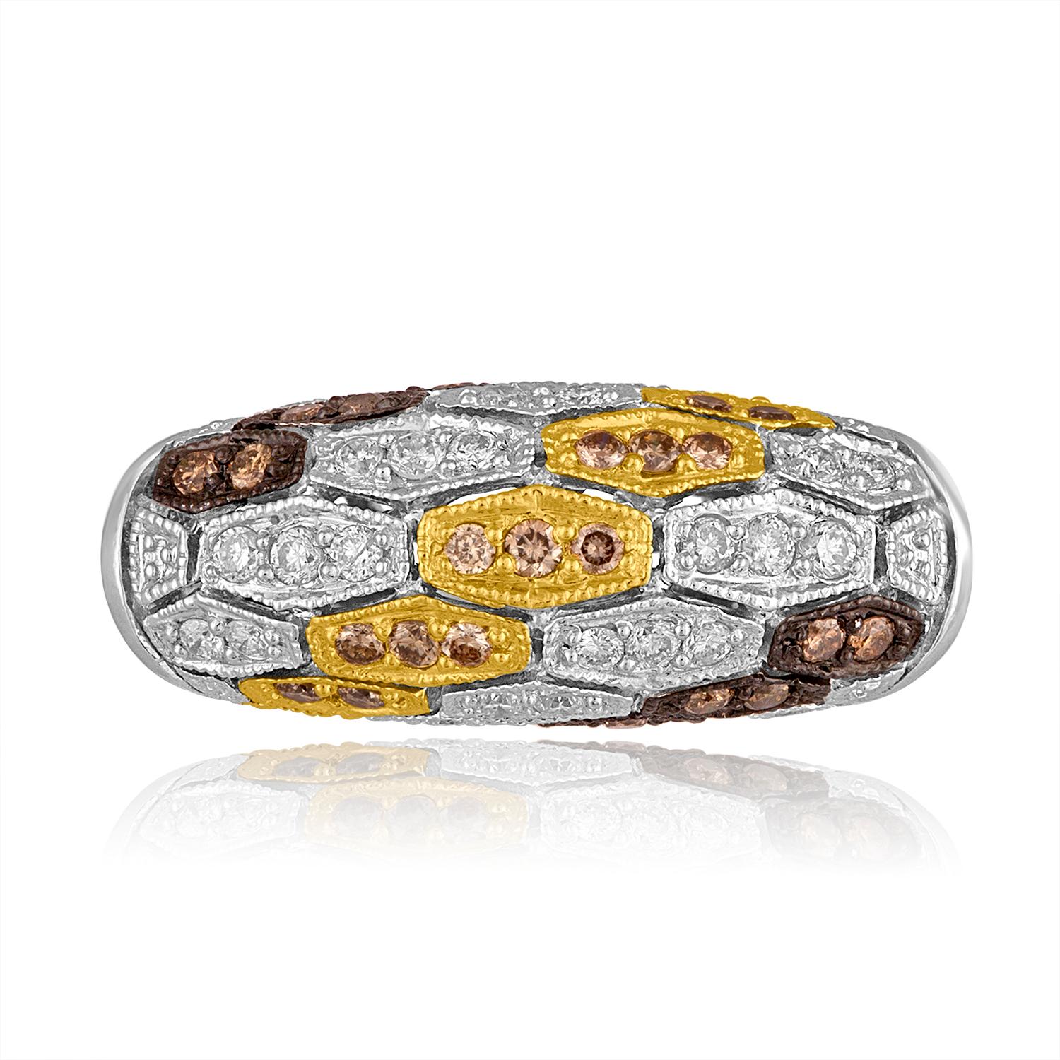 Unusual Dome Shaped Ring
The ring is 14K White Gold
There are 0.66 Carats in White Diamonds G SI
There are 0.30 Carats in Champagne & Brown Diamonds
The center has Yellow Gold Plating
The sides have Black Rhodium Plating
The ring looks like it has