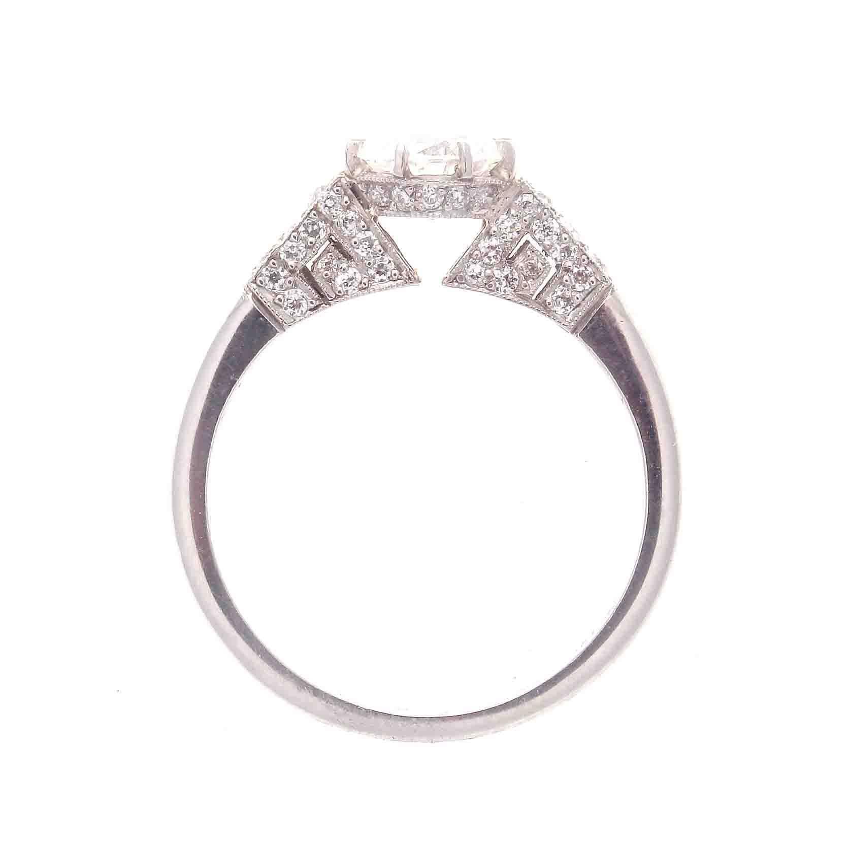 A modern creation of delicate brilliance staying true to traditional ideology. Featuring a 0.96 carat round brilliant cut diamond that is I color, VS2 clarity. Masterfully hand crafted in platinum.

Ring size 7 and may easily be resized to fit, if