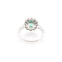 0.96 Carat Emerald and Diamond Halo Ring Set in Platinum