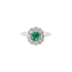 0.96 Carat Emerald and Diamond Halo Ring Set in Platinum