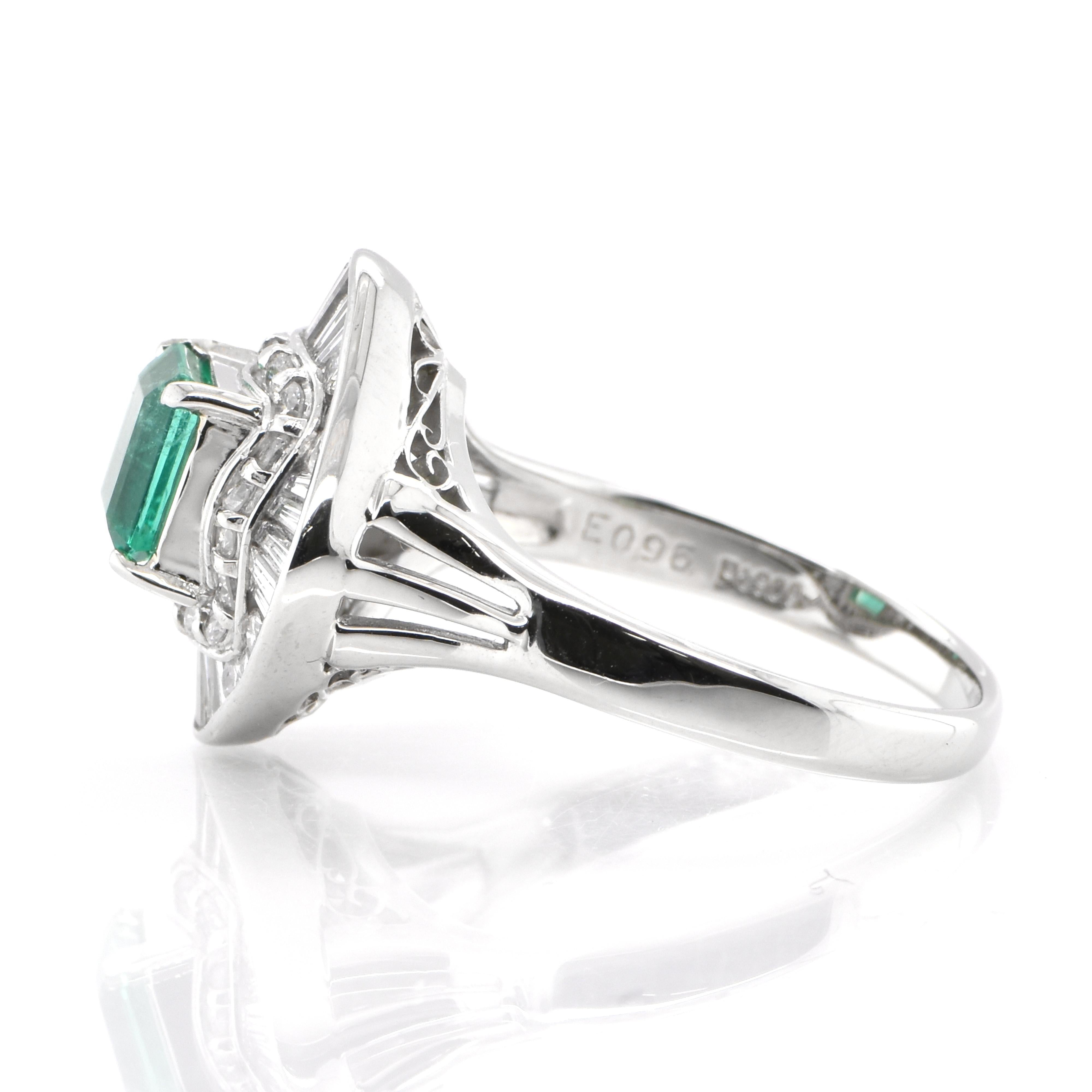 Emerald Cut  0.96 Carat Natural Emerald and Diamond Vintage Ballerina Ring set in Platinum For Sale