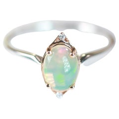 Vintage 0.96 Carat Oval Cab Ethiopian Opal and Round Diamond 14K Two Tone Gold Ring