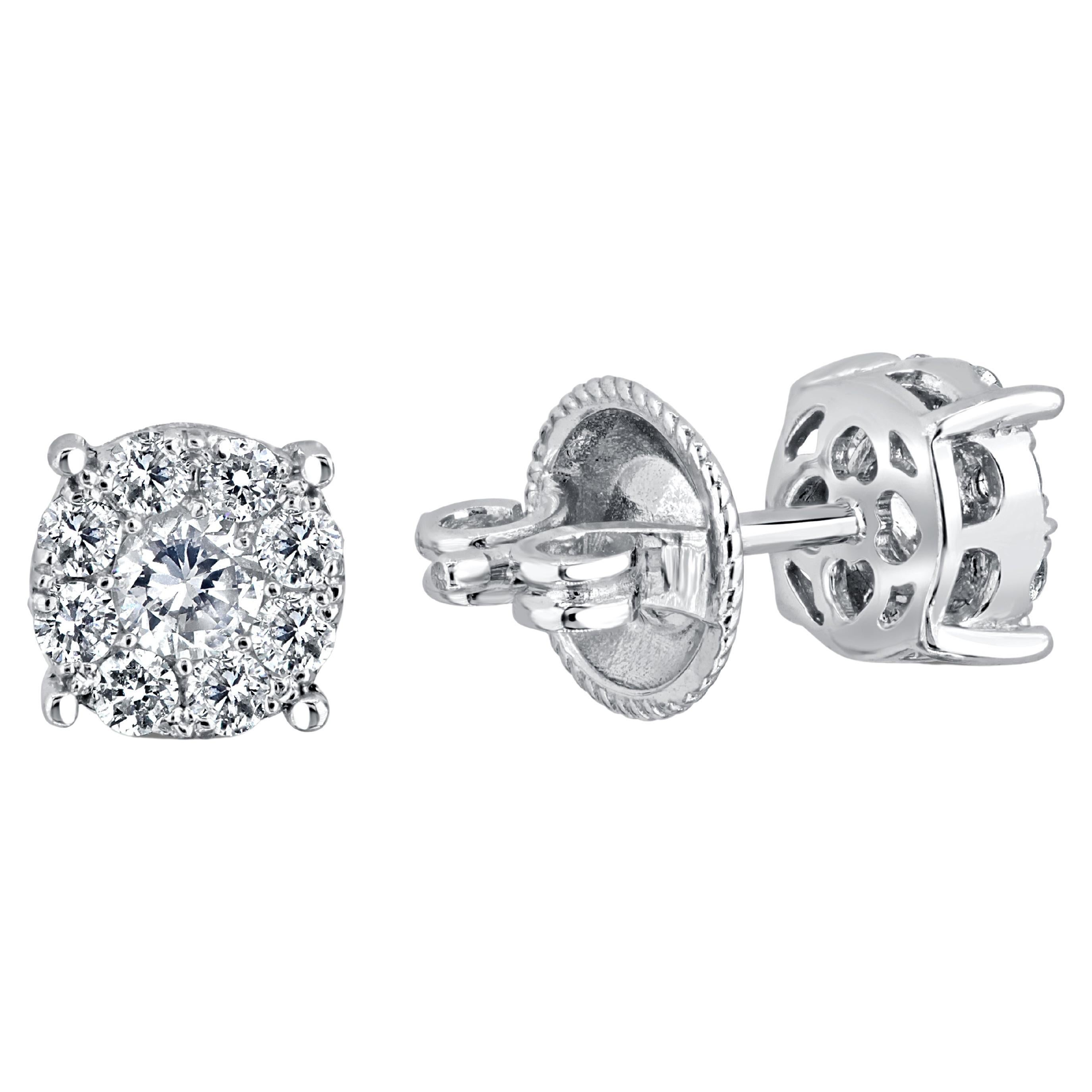 Indulge in the allure of these exquisite earrings, meticulously designed to create an illusion of a single, magnificent round diamond at the center. The clever arrangement of multiple closely-set round diamonds forms a breathtaking visual
