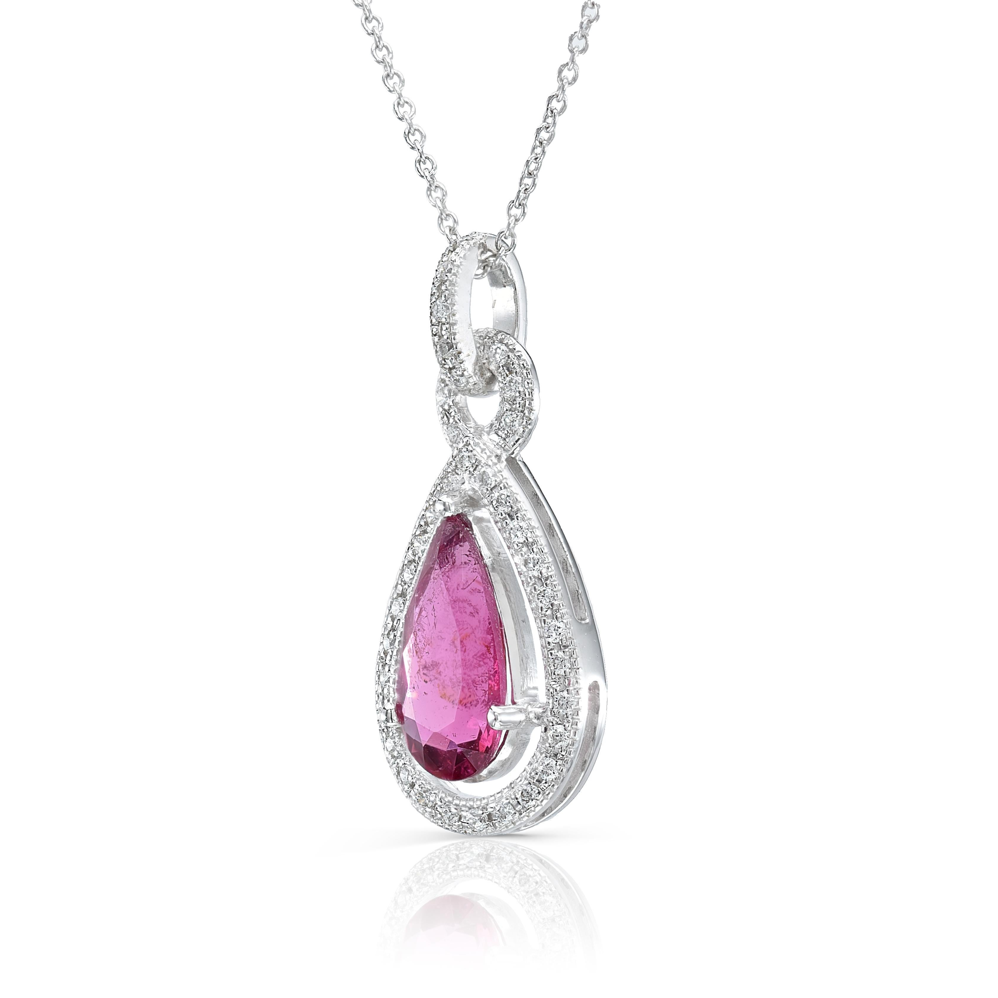 Discover Purplish Red Rubellite with the perfect blend of color could be hard to find. This 0.96 carats pear shaped Rubellite with 0.13 carats Diamonds has both the perfect color and cut that reflect just the right amount of light through the