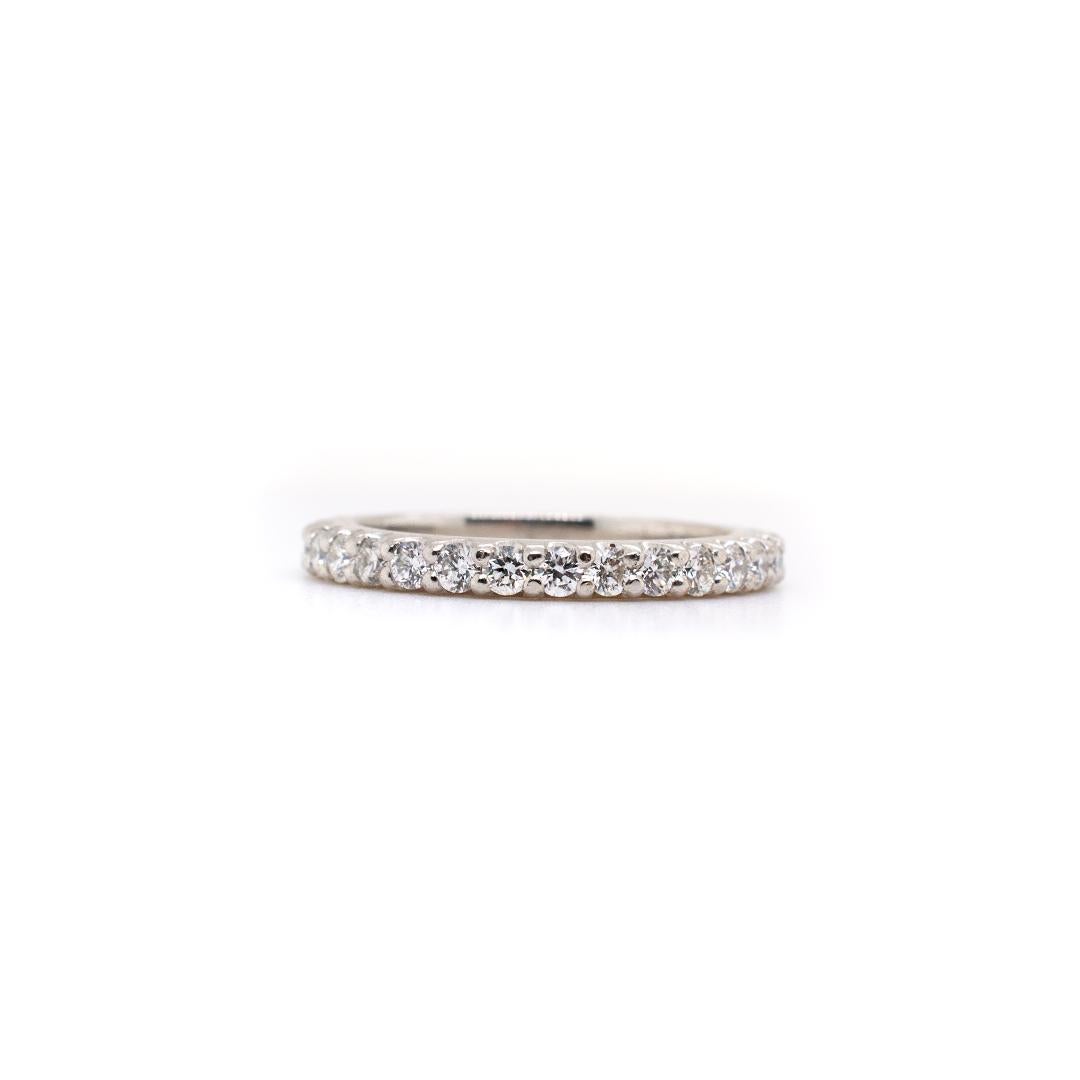 One ladies hand made polished platinum, diamond anniversary, eternity ring with a soft-square shank. The ring is a size 5.25 and is 3.41mm thick tapering to 2.30mm in width. The ring weighs a total of 4.60 grams. Engraved with 