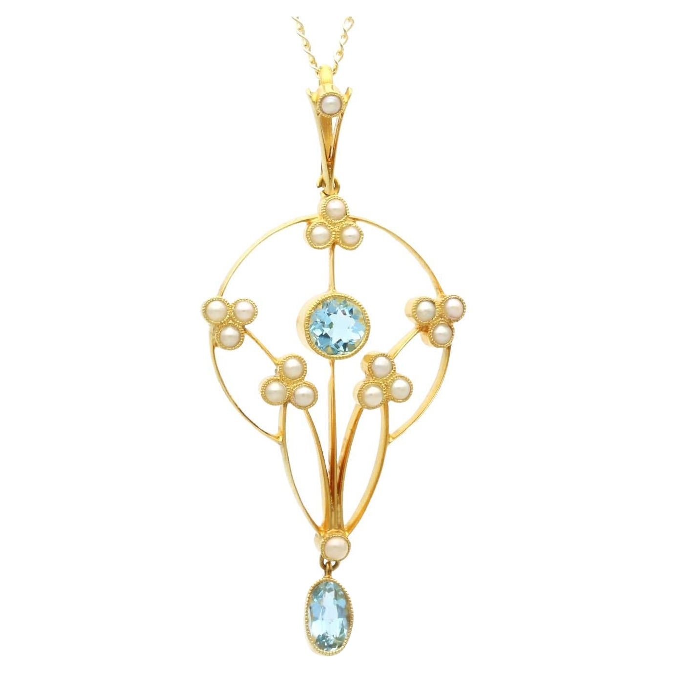 Colgante estilo Art Nouveau de oro amarillo de 15 quilates con aguamarina y perla de 0,96 ct