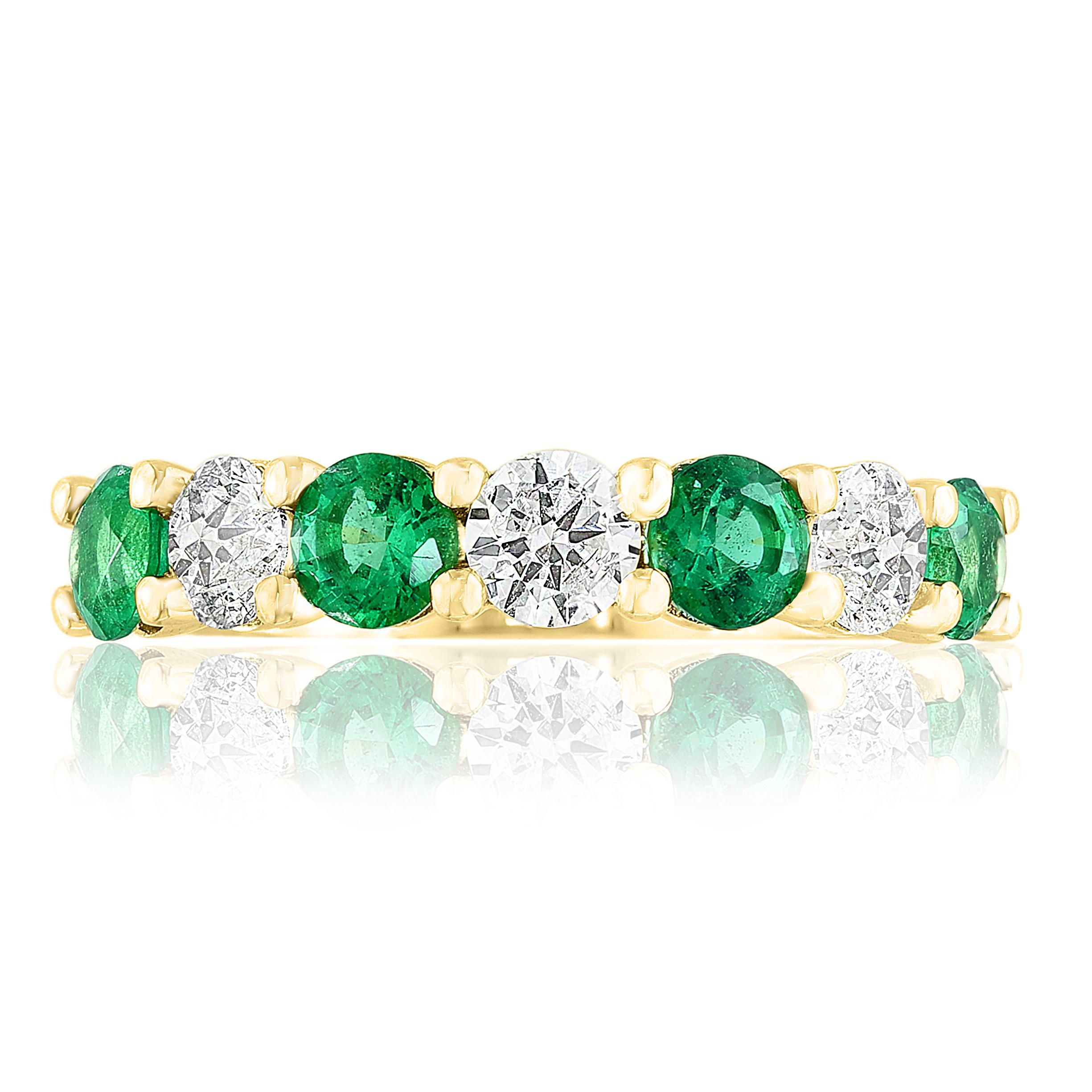 A fashionable and classic wedding band showcasing 4 color-rich green emeralds weighing 0.97 carats total that alternate with 3 brilliant round diamonds weighing 0.73 carats total. Stones secured with a shared prong setting made with 14 karats yellow