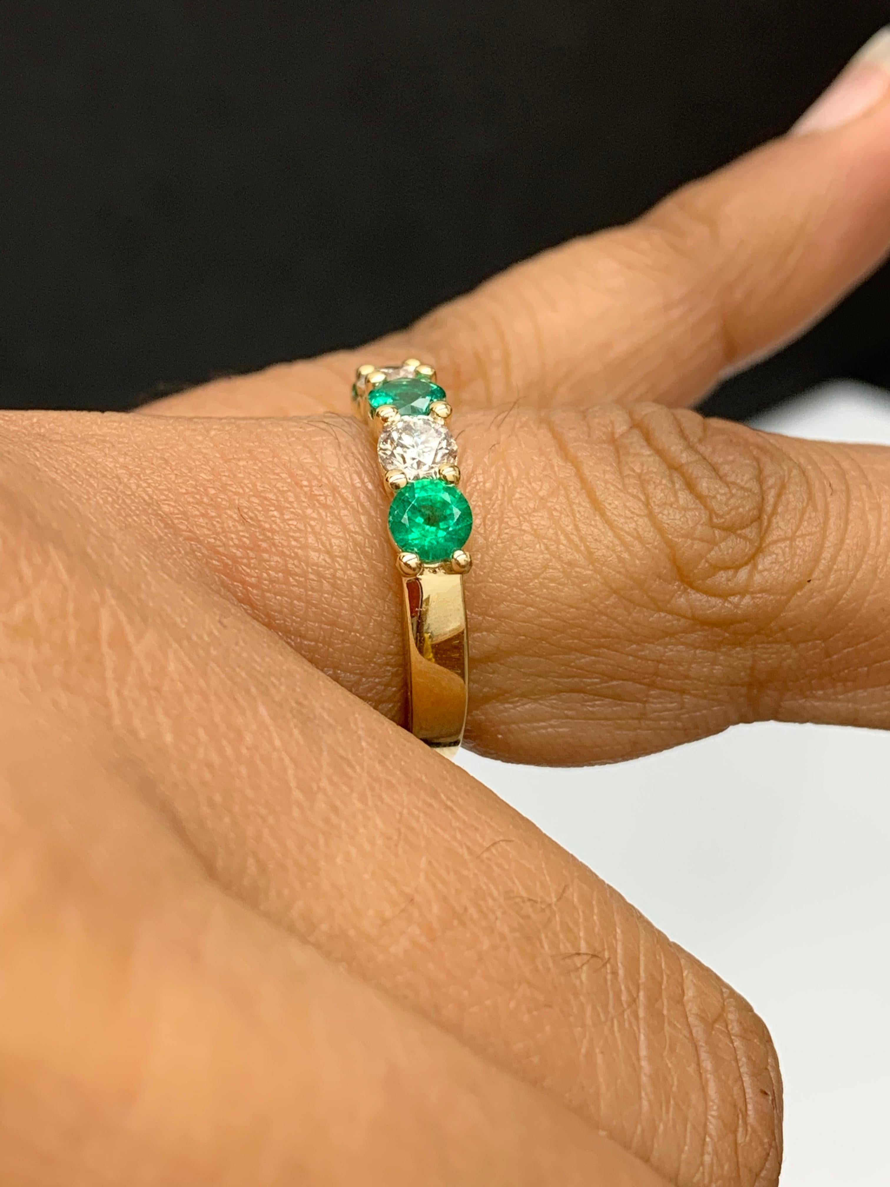 Women's 0.97 Carat Alternating Emerald and Diamond Halfway Wedding Band 14K Yellow Gold For Sale