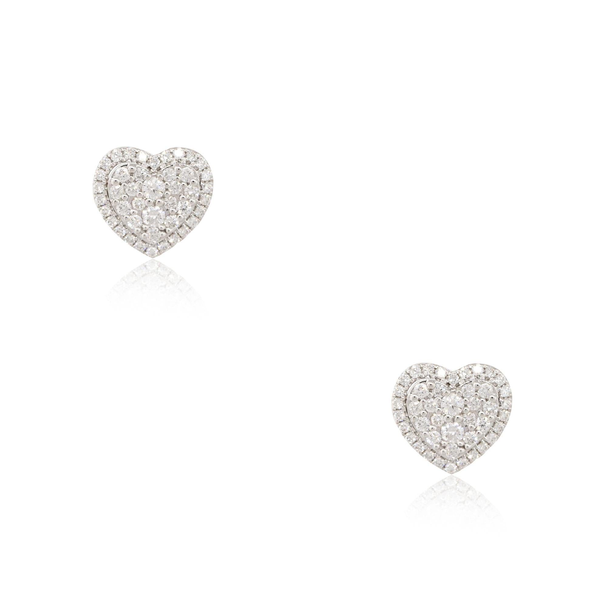 18k White Gold 0.97ctw Diamond Halo Pave Heart Stud Earrings
Material: 18k White Gold
Diamond Details: Approximately 0.97ctw of Pave Set Diamonds
Item Dimensions: 12.3mm x 3.3mm x 11.4mm 
Item Weight: 4.66g (3.1dwt)
Earring Backs: Friction
