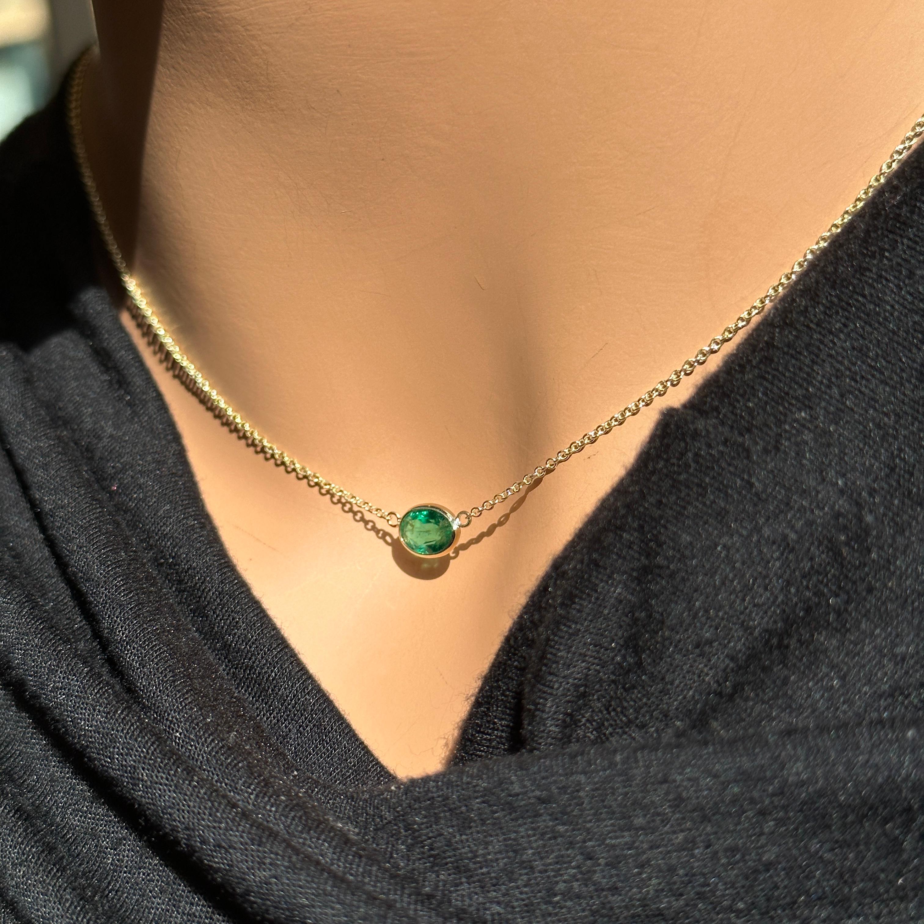 A fashion necklace crafted in 14k yellow gold with a main stone of an oval-cut emerald weighing 0.97 carats would be a beautiful and elegant choice. Emeralds are known for their rich green color and timeless appeal, and the oval cut adds a classic