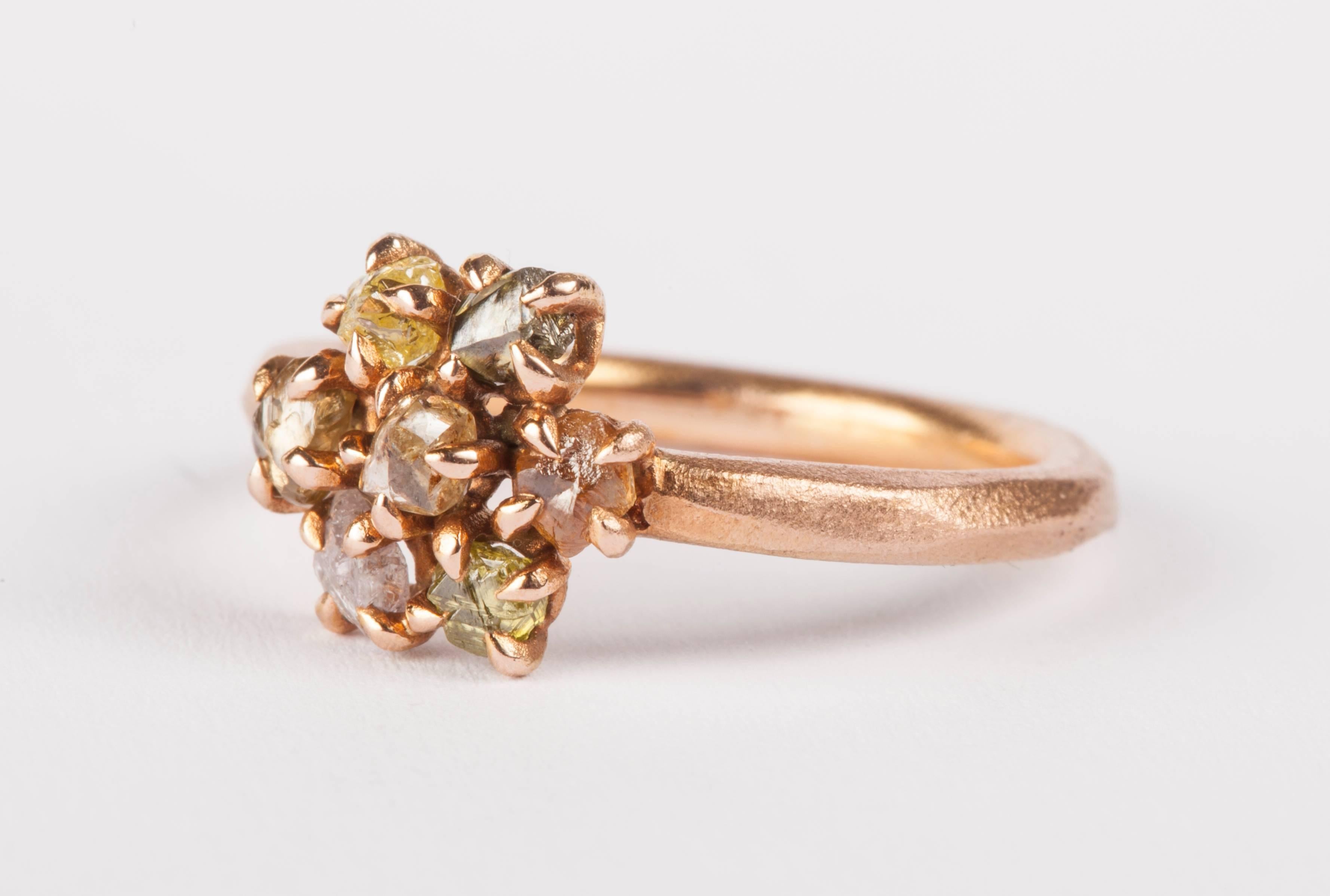 0.97 ct. Natural Fancy Colour Pink, Brown, Yellow, Green and Orange Rough Diamonds in 14K handcrafted rose gold ring.

Every rough diamond from Roughdiamonds dk has been personally handpicked by Maya Bjørnsten. The diamonds we reject are sent back