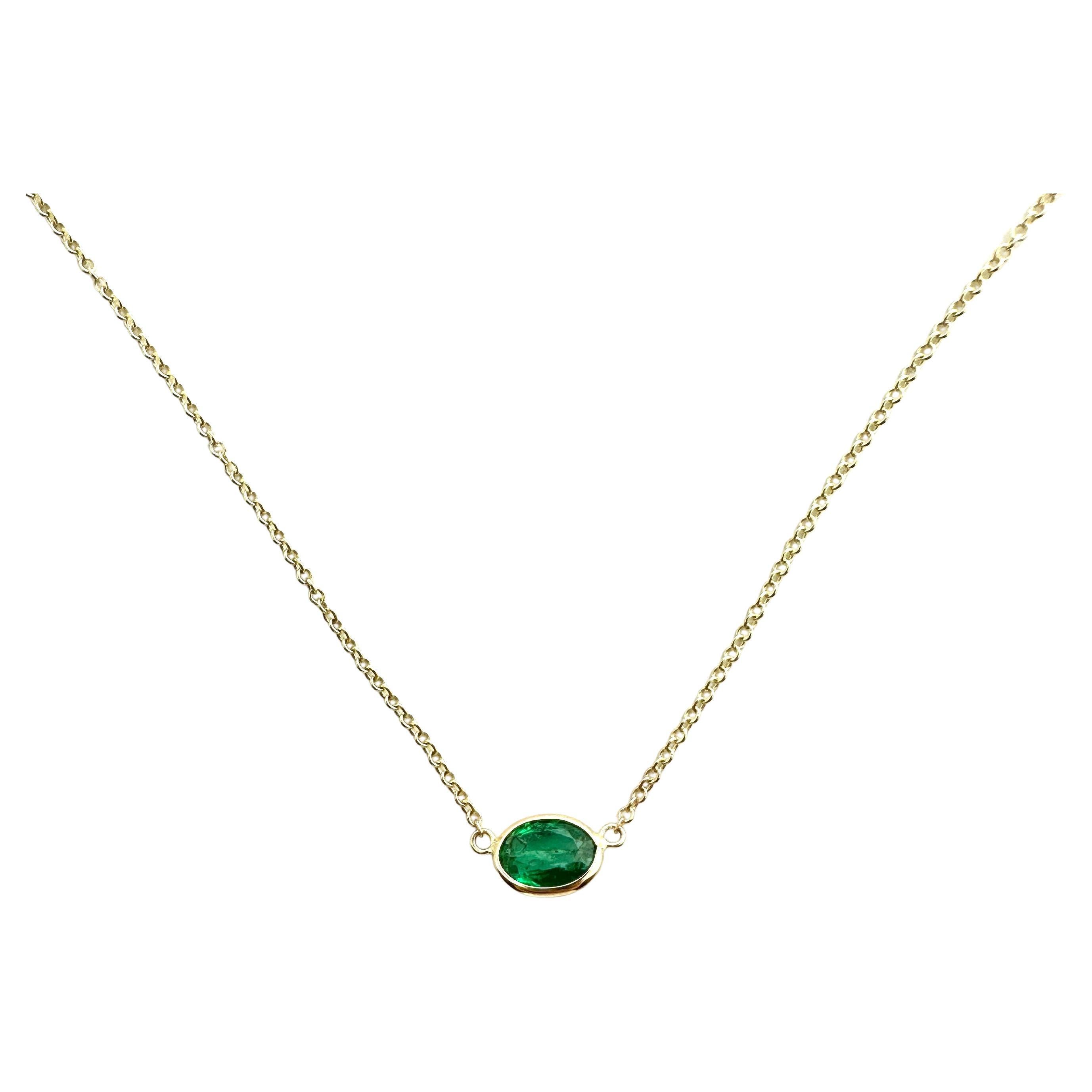 0.97 Carat Weight Green Emerald Oval Cut Solitaire Necklace in 14k Yellow Gold For Sale