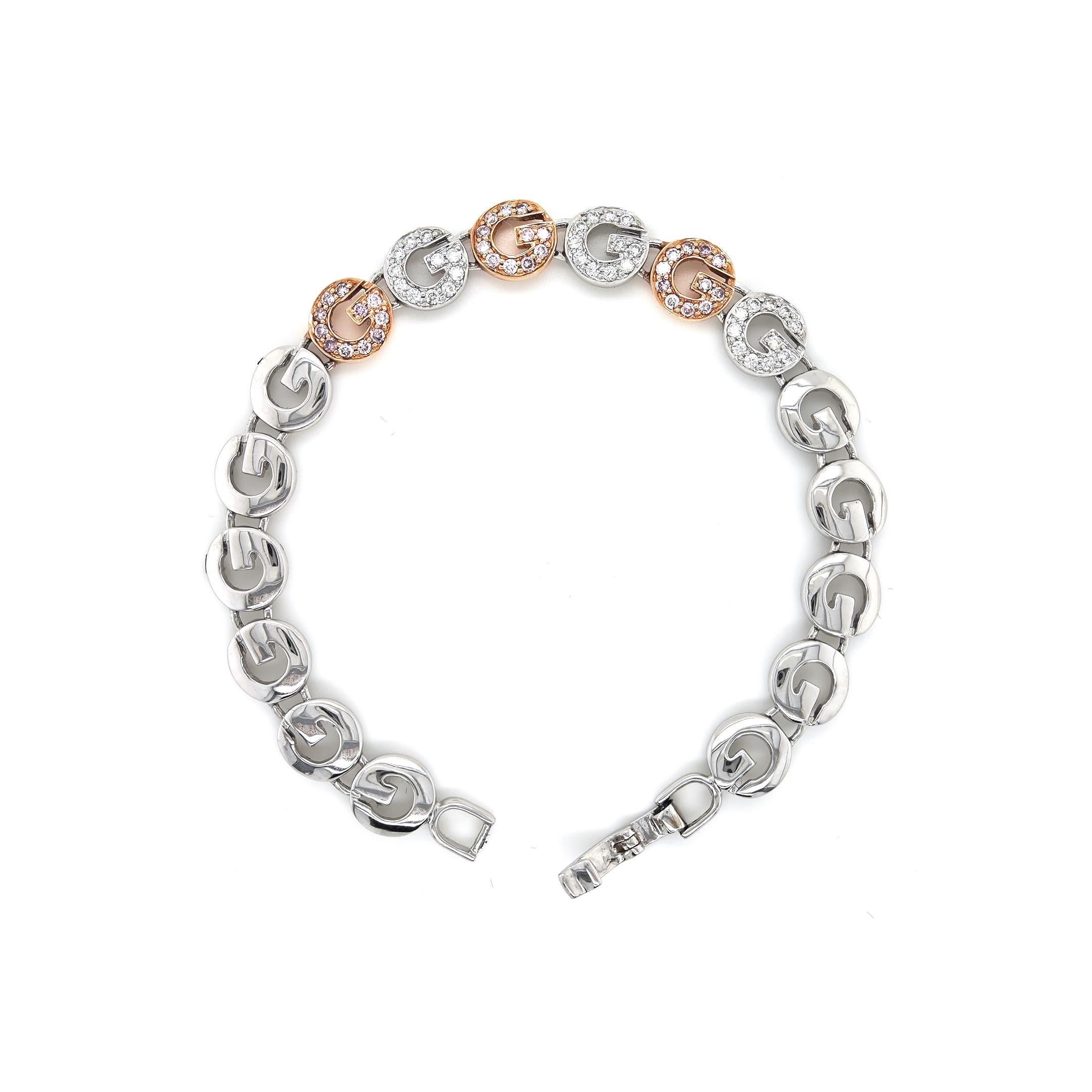 66 White Diamonds: 0.97 Carats
Metal: 18K Rose and White Gold, 16.30 Grams
