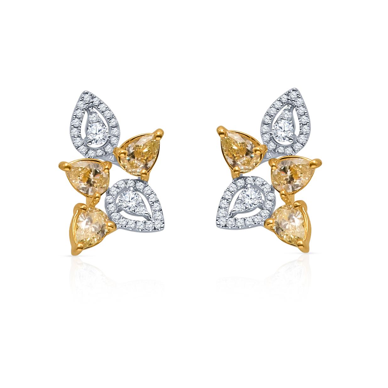 18kt white and yellow gold earrings with 0.97 carats total weight in pear shaped yellow diamonds and 0.27 carat total weight in pear shaped and round brilliant cut white diamonds, with friction posts and backs. This lovely floral design can be worn