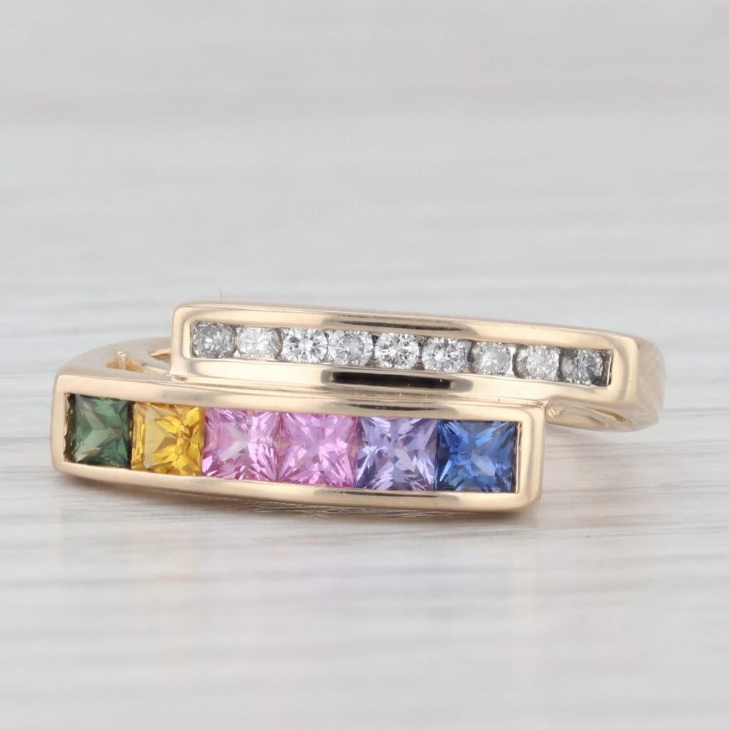Gemstone Information:
- Natural Sapphires -
Total Carats - 0.84ctw
Cut - Princess Brilliant
Color - Multicolor
Treatment - Heated

- Natural Diamonds -
Total Carats - 0.13ctw
Cut - Round Brilliant
Color - G - H
Clarity - SI2 - I1 

Metal: 14k Yellow