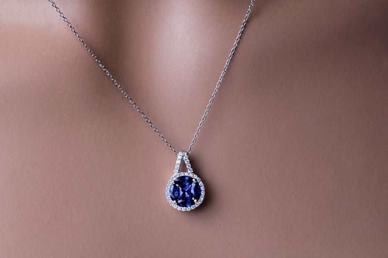 Mixed Cut 0.98 Carat Blue Sapphire with 0.19 Carat Diamond Halo Pendant in 18k White Gold For Sale