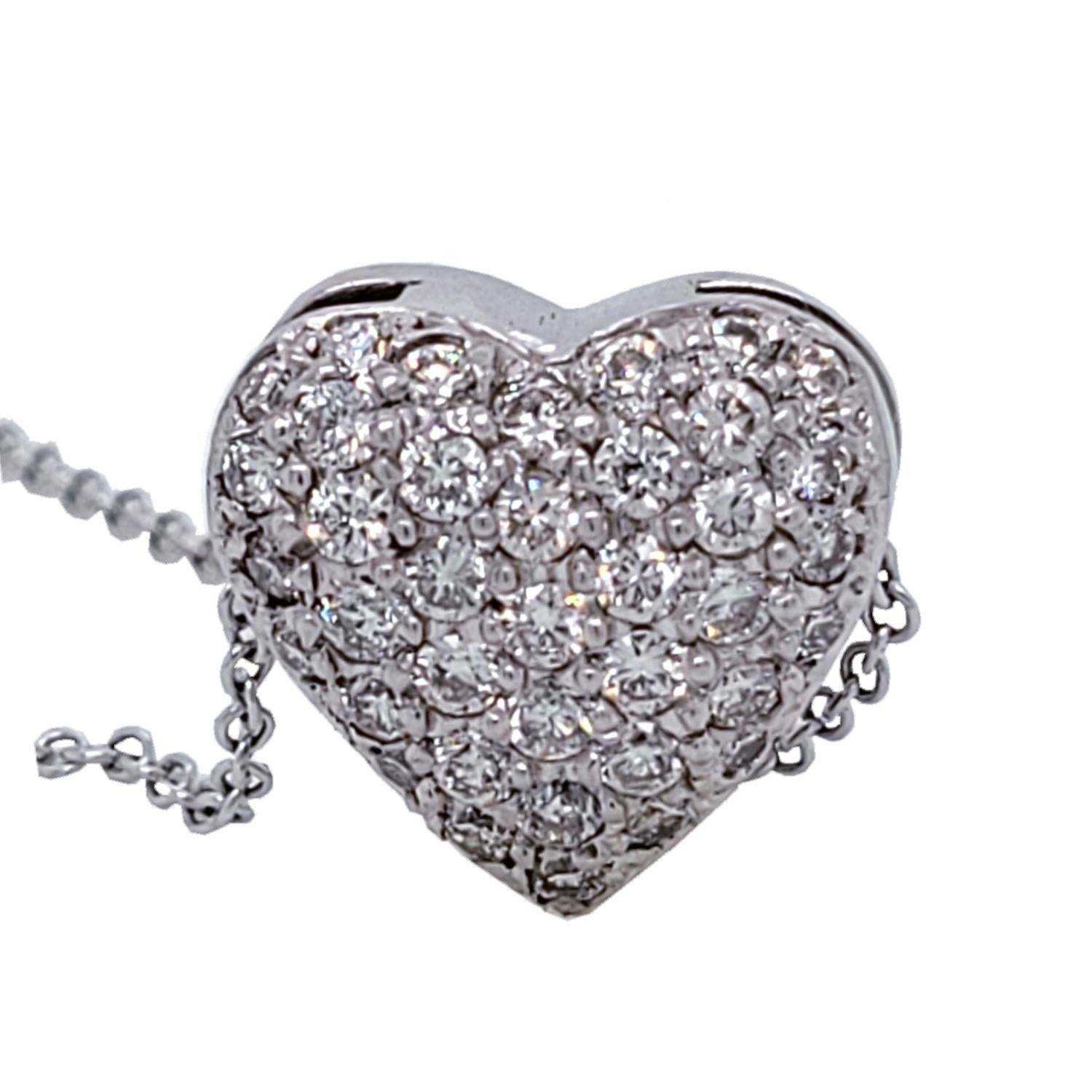 18K Domed Gold Heart shaped Pendant with 46 Pave Set Round Brilliant Diamonds  with total weight of 0.98 Ct. 
Total Diamond Weight: 0.98 Ct. The chain slides through the pendant.
Total Necklace Weight: 4.9 gr
Pendant Size 13x13 mm (5.8 mm