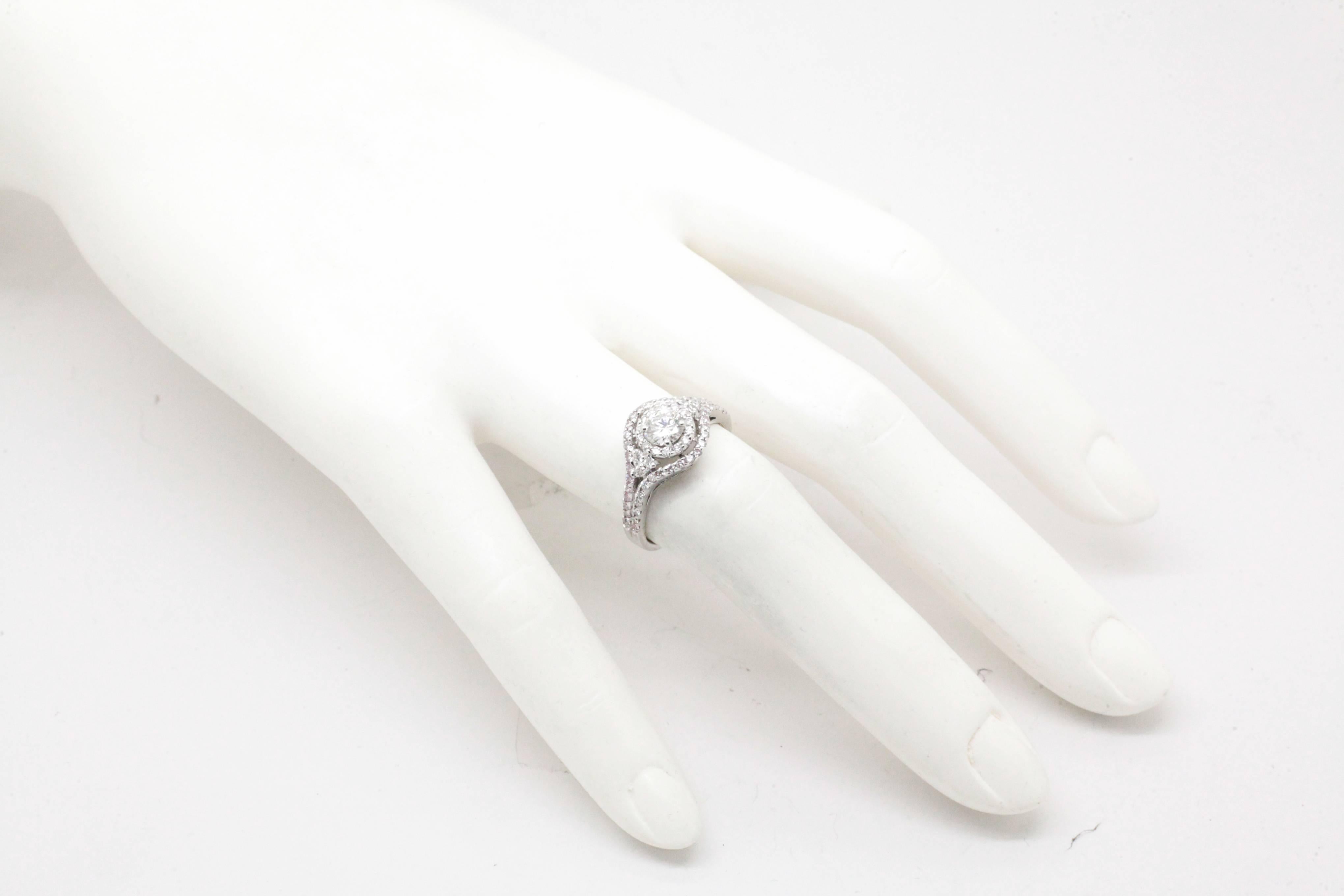 Women's 0.98 Carat Diamonds and Diamond Halo 18 Karat Gold Engagement Ring For Sale