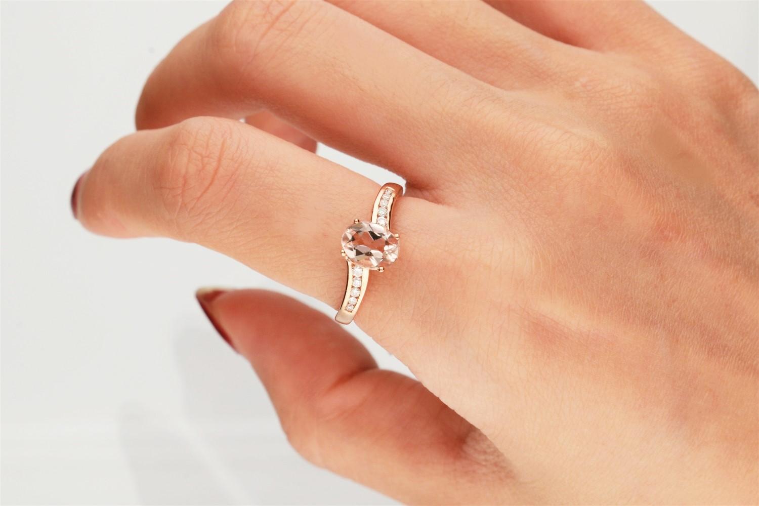 This elegant 10 karat rose gold ring features a pink oval-cut. Gin & Grace Genuine morganite gemstone measuring. Accented with eight round-cut diamonds side stones in a prong-setting and high polish finish. Gemstone colors: Pink Gemstone shapes: