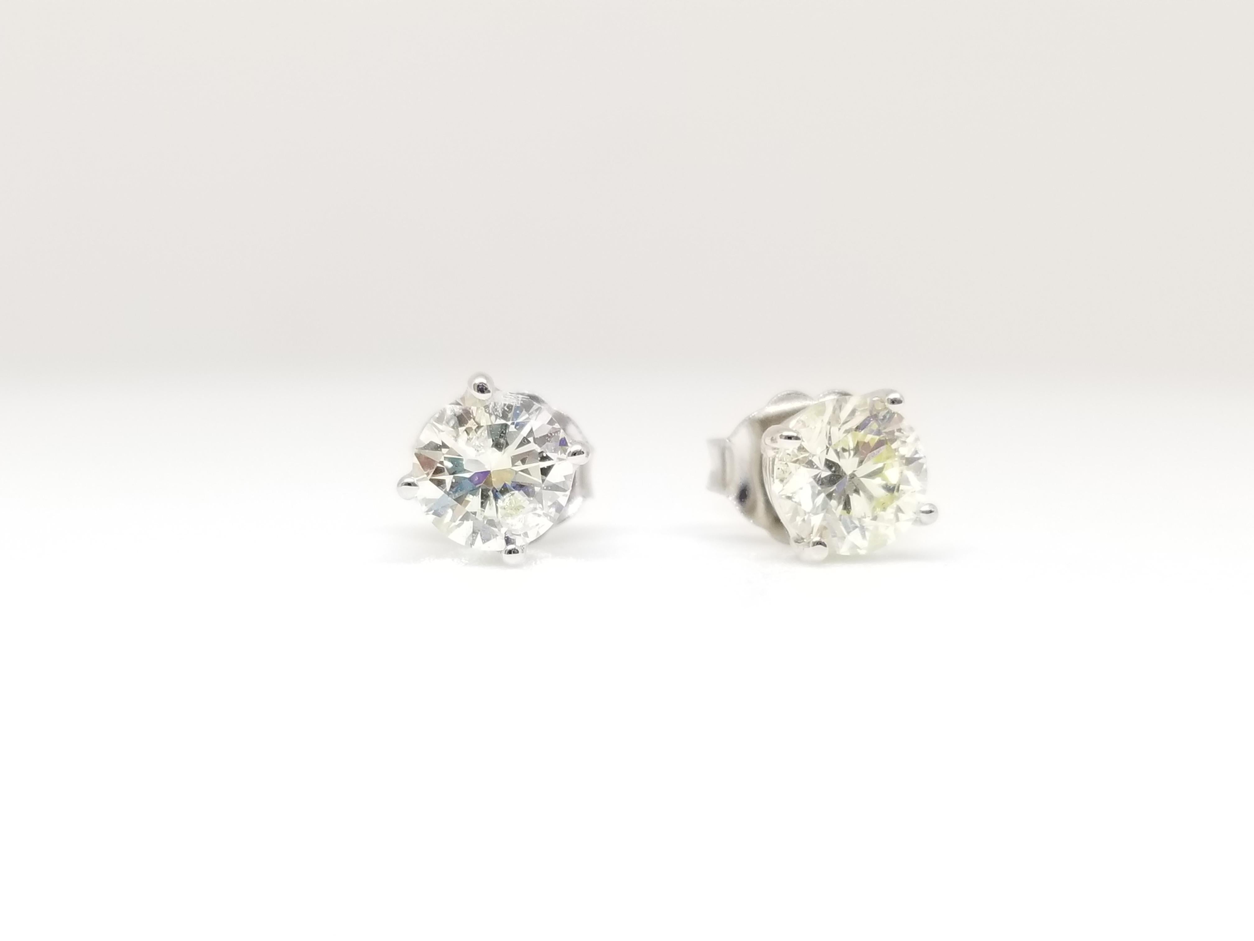 Natural Round Diamond Studs set in 4 prong push back 14k white gold 0.98 carats total weight. Color I-J, Clarity SI.
