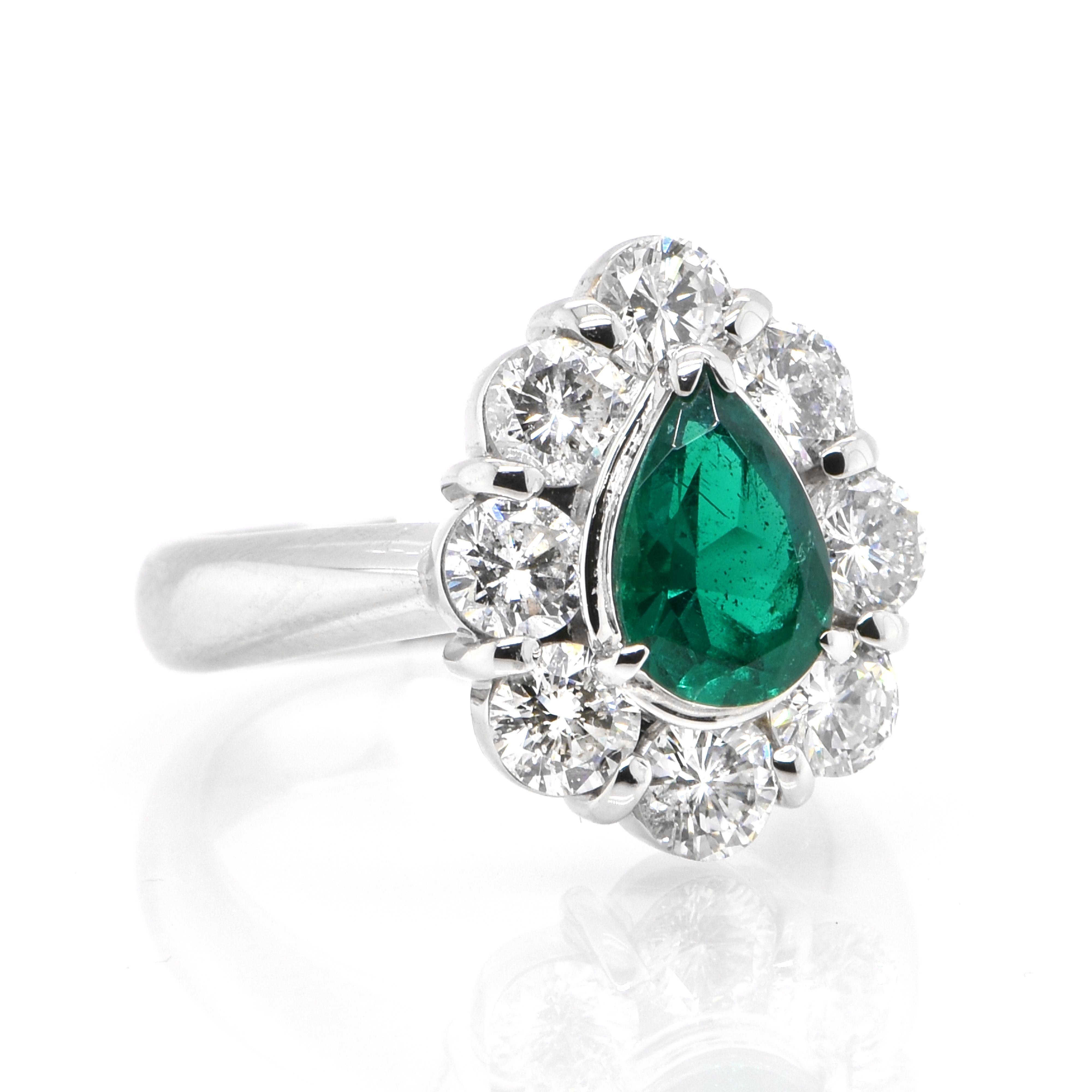 Modern 0.98 Carat Natural Pear-Shaped Emerald and Diamond Ring Set in Platinum For Sale