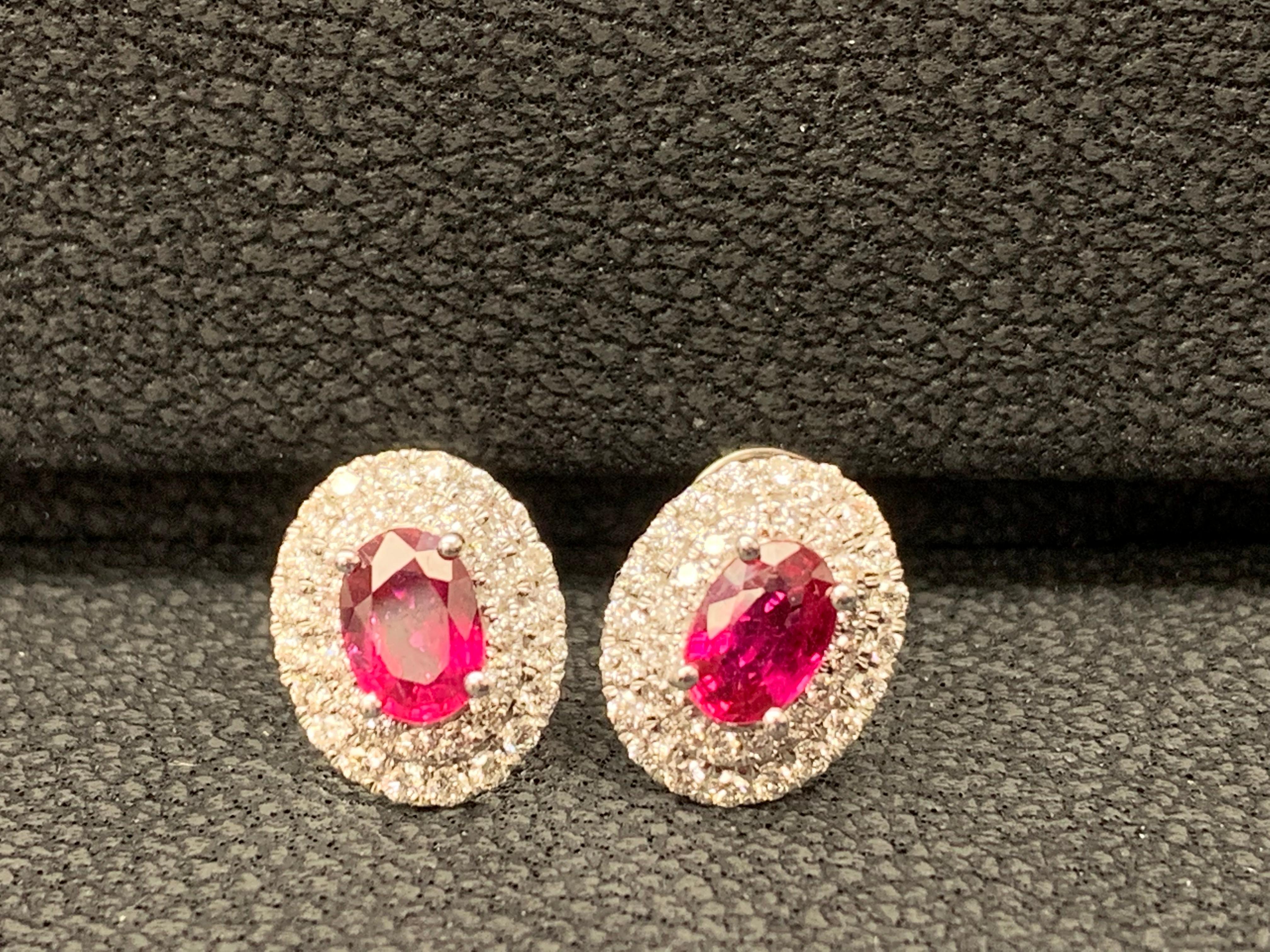 Contemporary 0.98 Carat Oval Cut Ruby and Diamond Stud Earrings in 18K White Gold For Sale