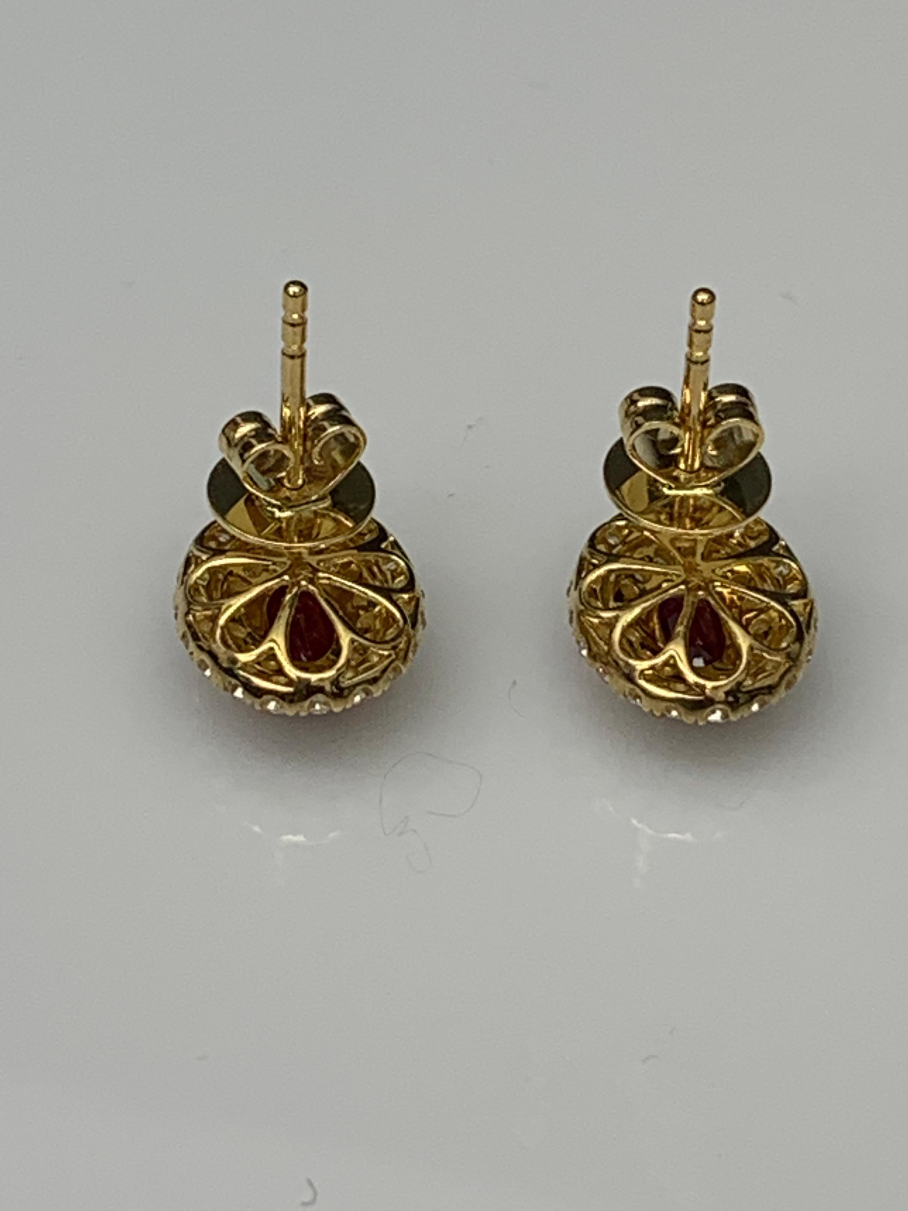 Women's 0.98 Carat Oval Cut Ruby and Diamond Stud Earrings in 18K Yellow Gold For Sale