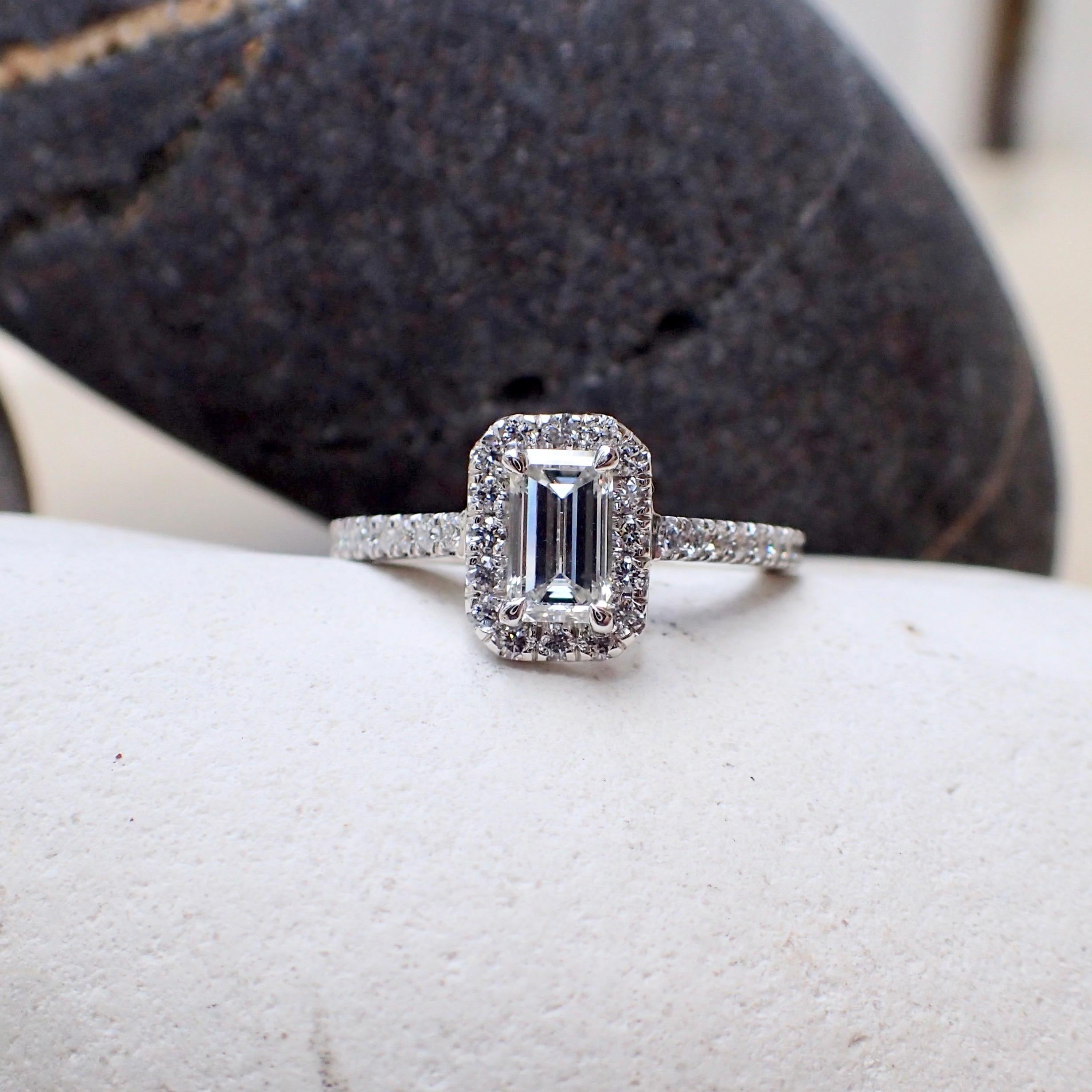 One (1) Platinum engagement ring contains one (1) Emerald Cut diamond that weighs 0.60 carats that measure 6.17 x 3.73 x 2.68mm with Clarity Grade VS1 with Color Grade H with Good Polish with Very Good Symmetry and is inscribed with GIA 1172468818