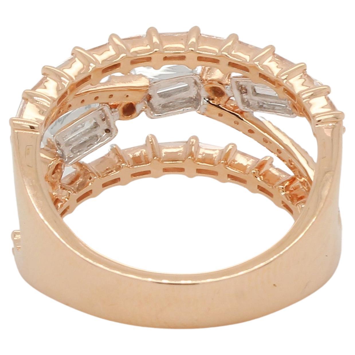 This wedding ring is made of 18 karat gold and designed with diamond illusion for a modern, sophisticated look. It includes 0.20 carats of round diamonds and 0.78 carats of tappers, giving it an illusion in the center and on both sides for a