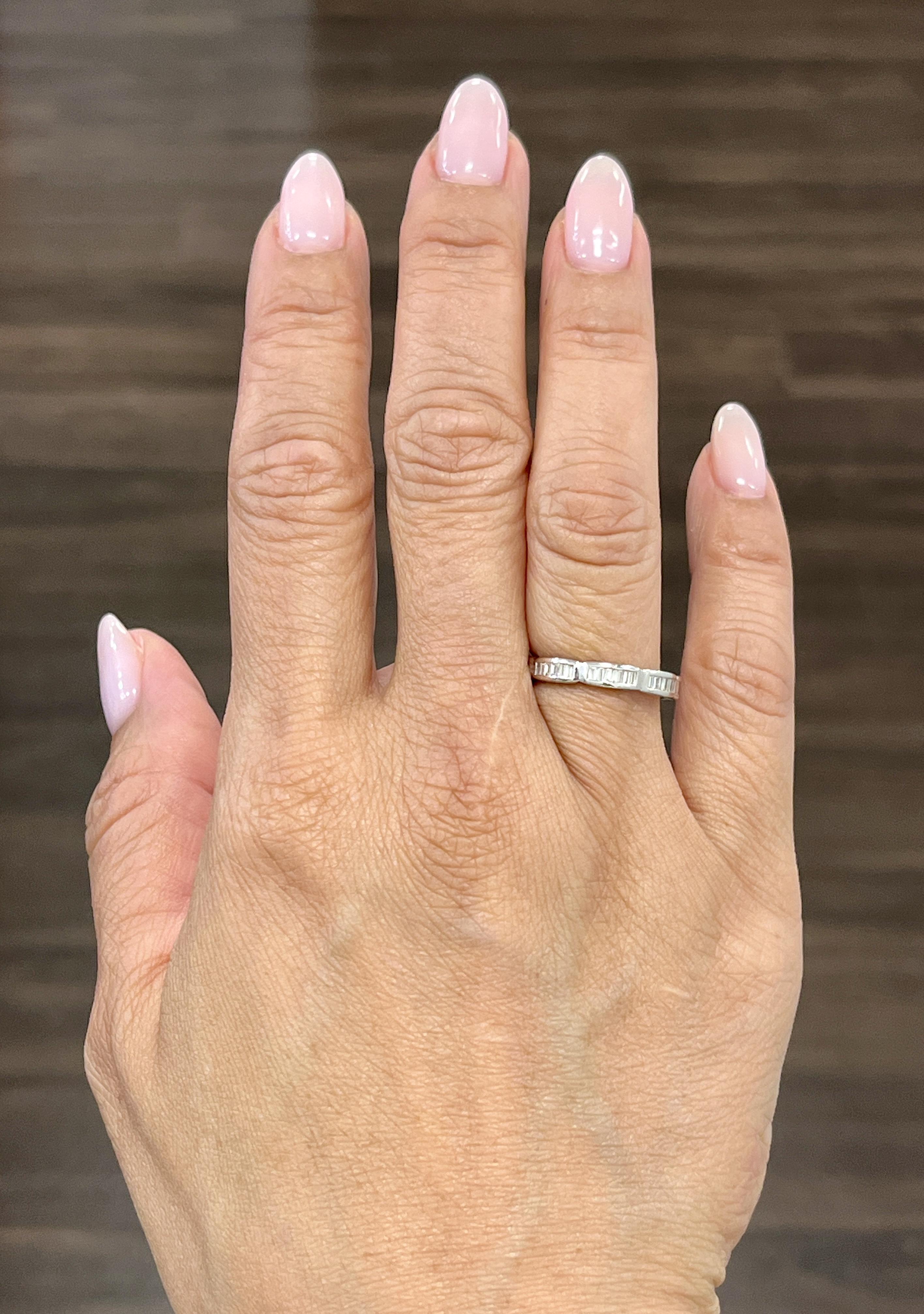 This stunning eternity ring features baguette diamonds all around. The diamonds showcase a color of F/G and VS1/VS2 in clarity. A beautiful ring to adorn anyone's hand.