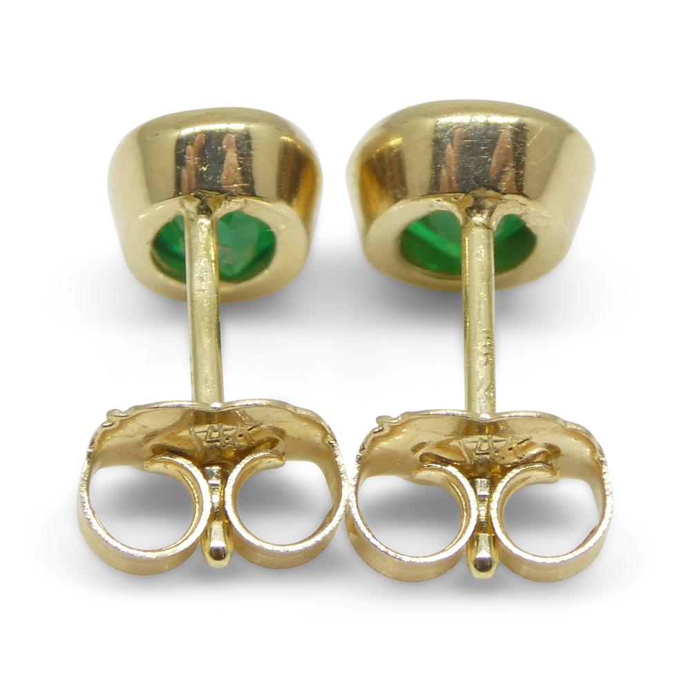Contemporary 0.98ct Colombian Emerald Stud Earrings set in 14k Yellow Gold For Sale