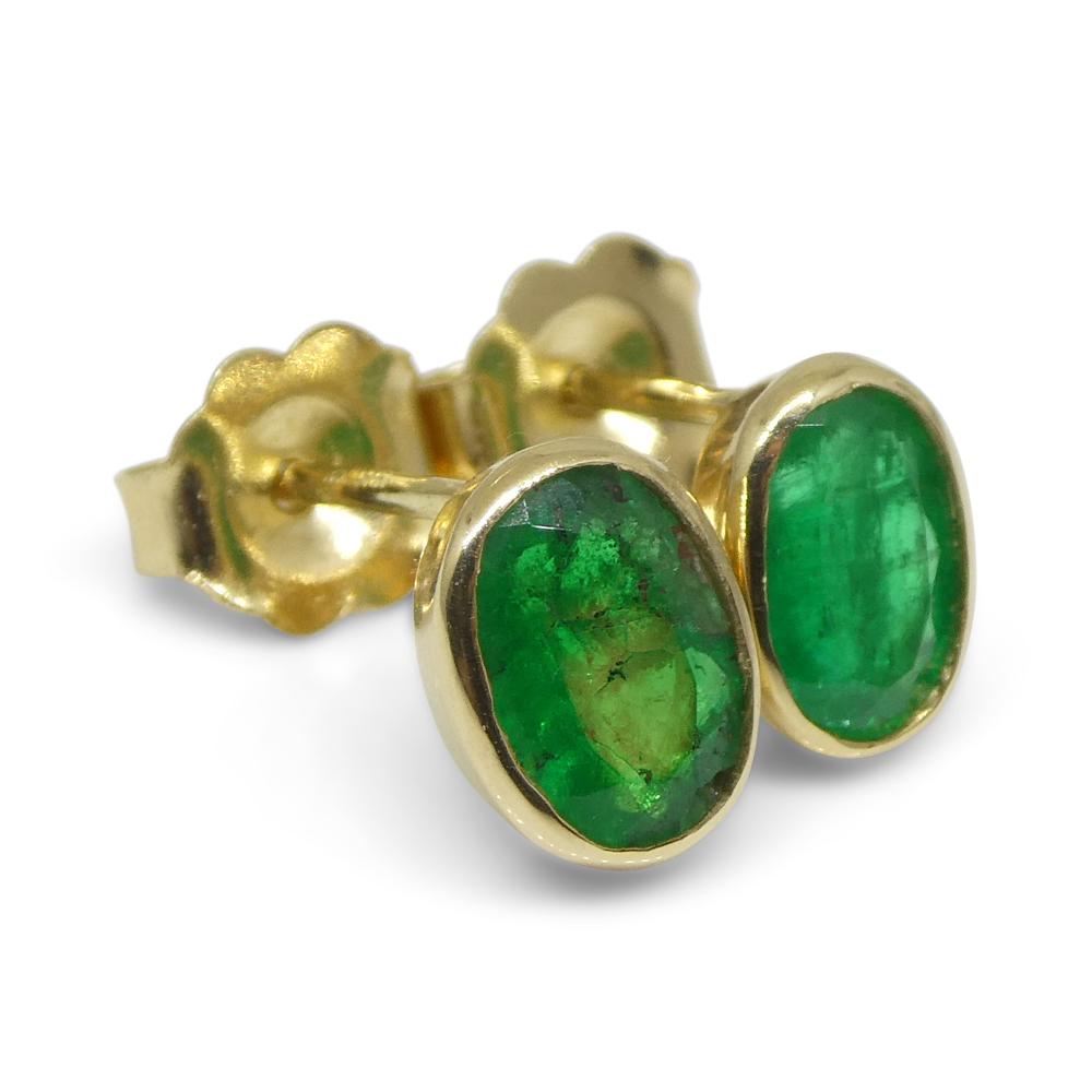 Emerald Cut 0.98ct Colombian Emerald Stud Earrings set in 14k Yellow Gold For Sale