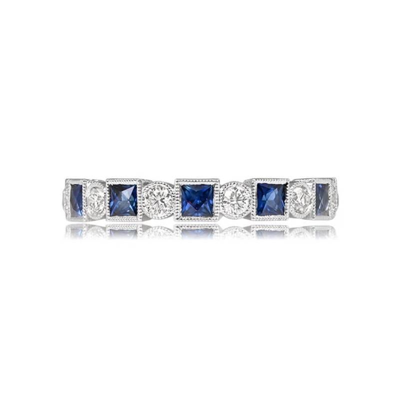 A stunning 18k white gold eternity band adorned with 0.98 carats of French-cut natural sapphires and 0.32 carats of round brilliant cut diamonds. This band features meticulous hand engravings and delicate milgrain details.

Ring Size: 5.75 US,