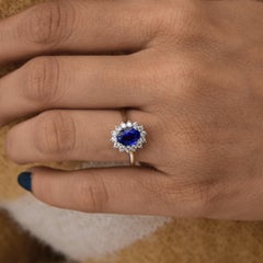 Spectrum 14k White Gold Oval Blue Sapphire and Diamond Halo Ring