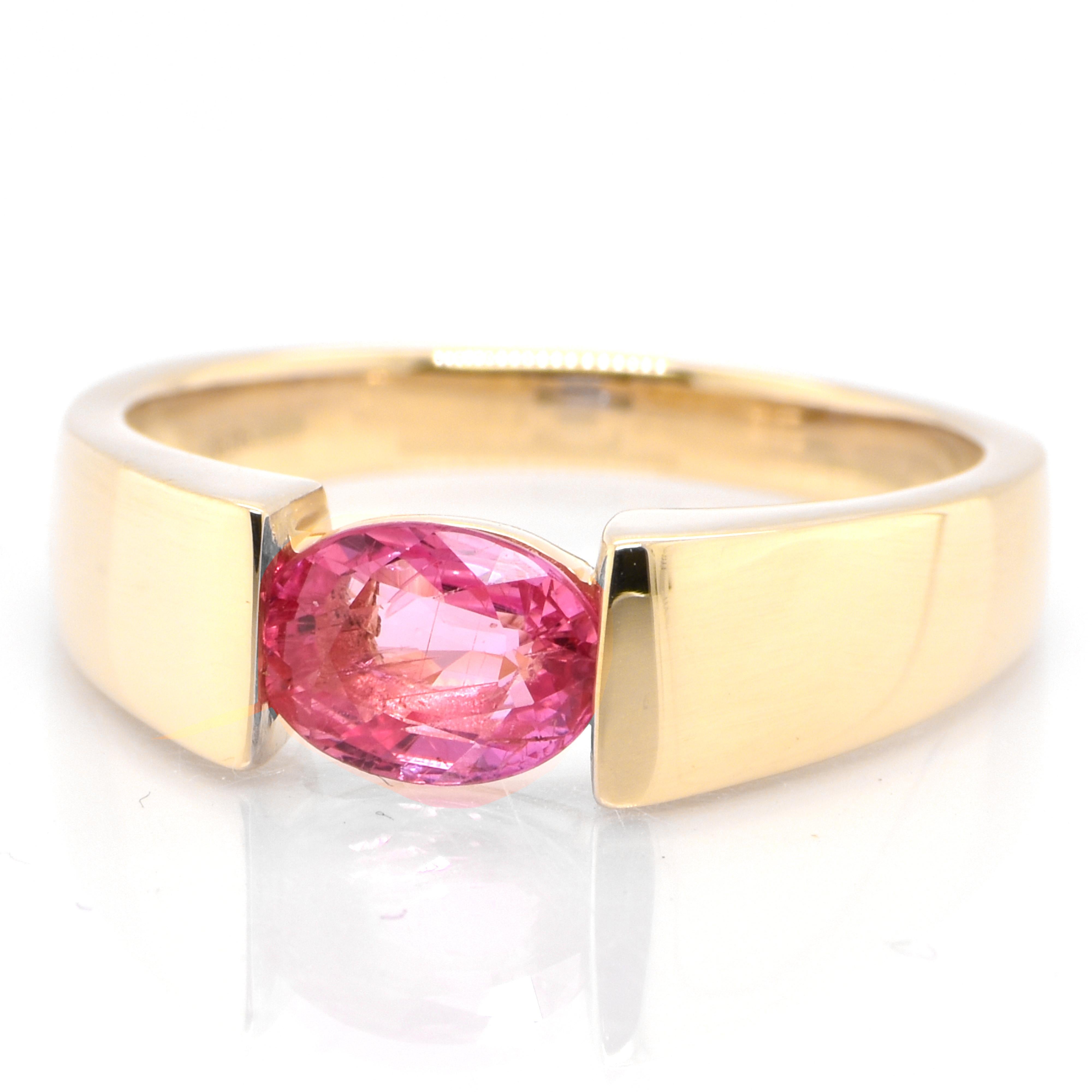 A beautiful ring featuring 0.99 Carat Natural Padparadscha Sapphire set in 18 Karat Yellow Gold. Sapphires have extraordinary durability - they excel in hardness as well as toughness and durability making them very popular in jewelry. Traditionally,