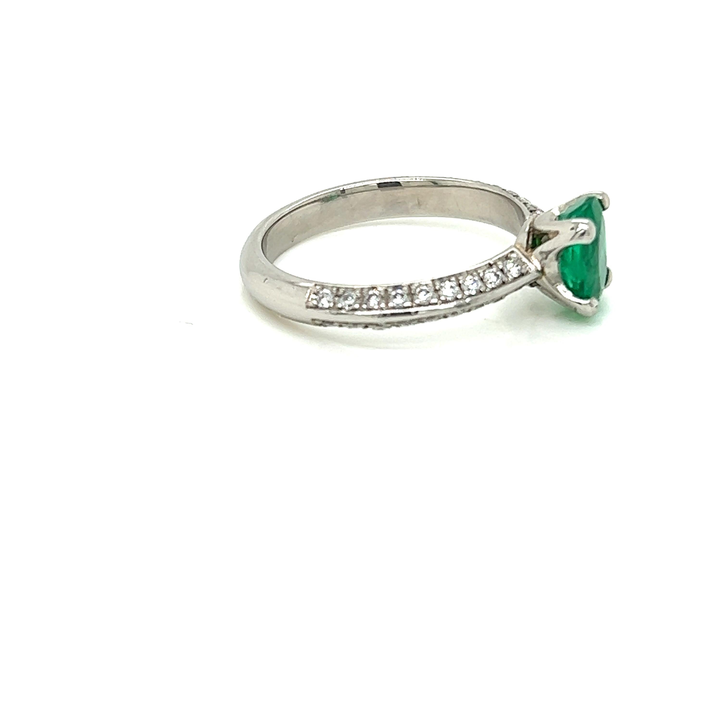 Oval Cut 0.99 Carat Oval Emerald and Diamond Ring in Platinum For Sale
