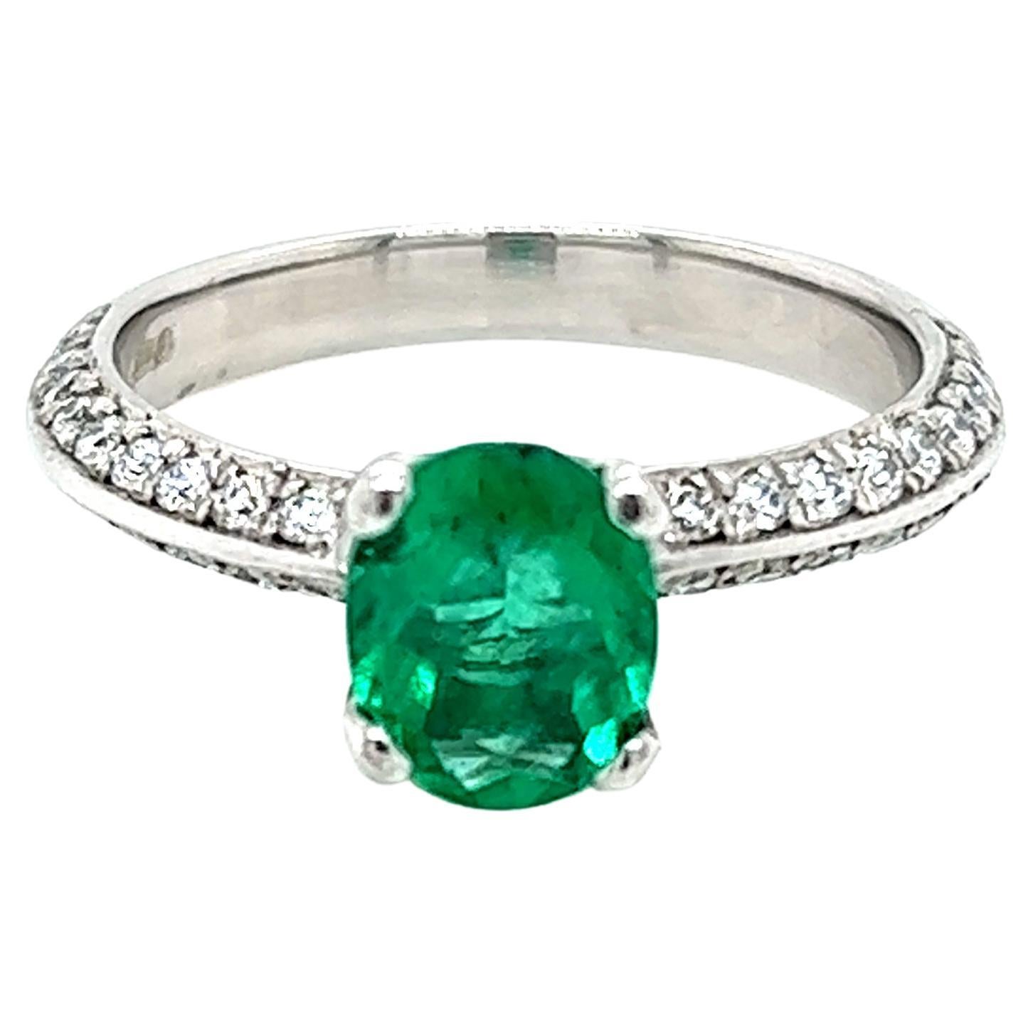 0.99 Carat Oval Emerald and Diamond Ring in Platinum For Sale