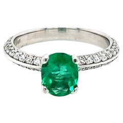 0.99 Carat Oval Emerald and Diamond Ring in Platinum