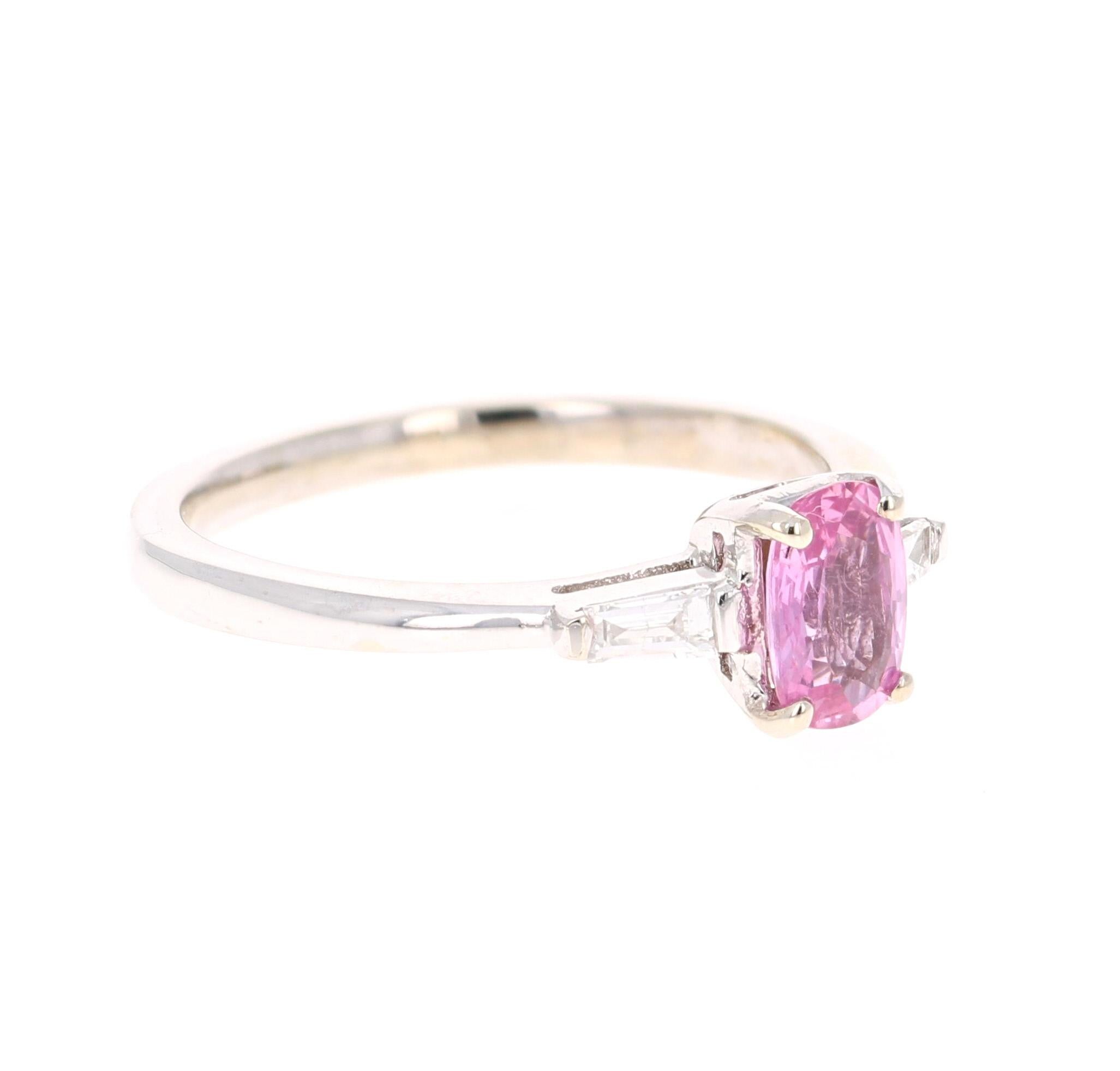 Cute Pink Sapphire and Diamond Ring! Can be an everyday ring, promise ring or even an engagement ring!

It has a Oval Cut Pink Sapphire that weights 0.82 Carats and 2 Baguette Cut Diamonds that weigh 0.17 Carats. (Clarity: VS, Color: H) The total